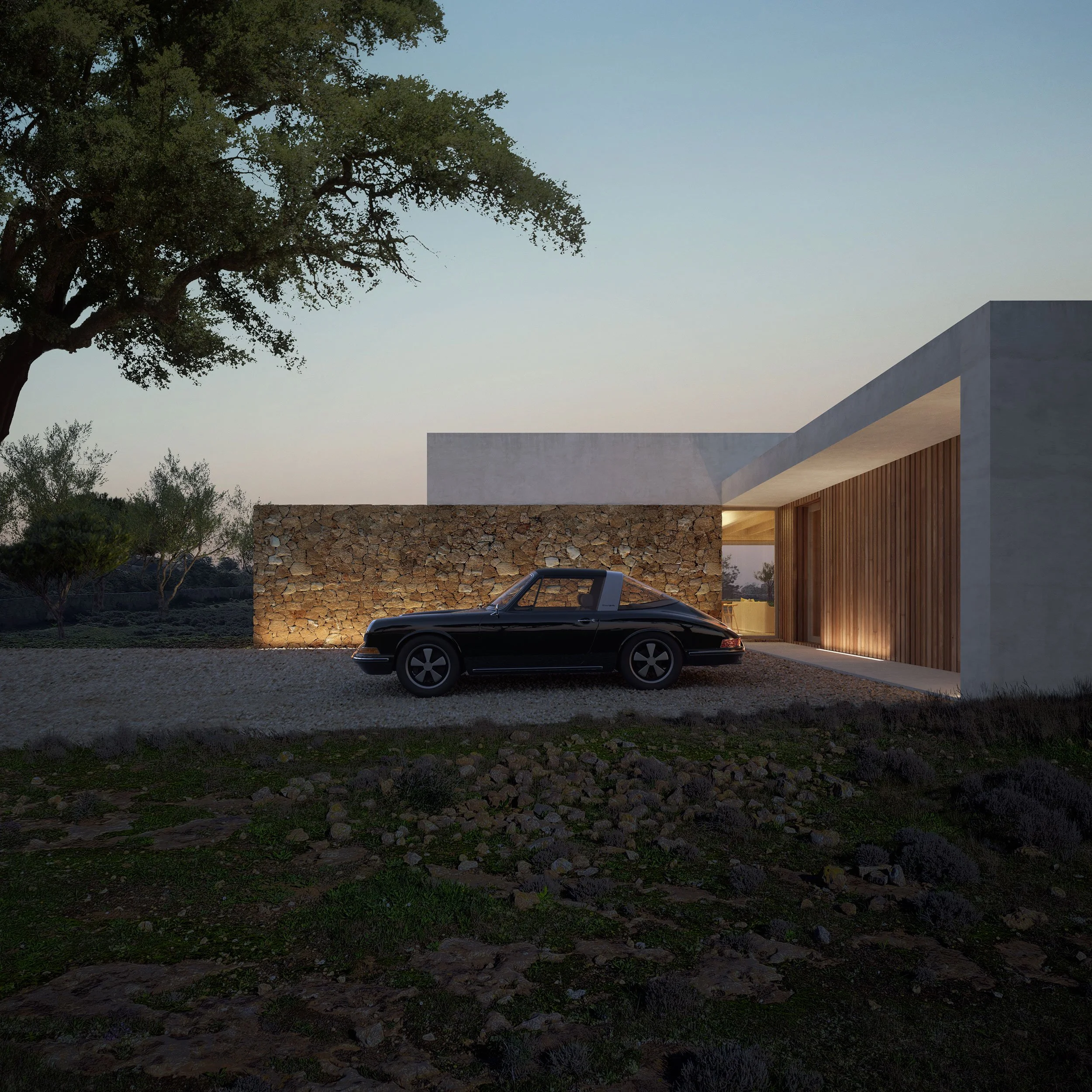 Modern house with stone and concrete exterior, illuminated warm interior lighting, parked black vintage car in front, surrounded by rural landscape at dusk.