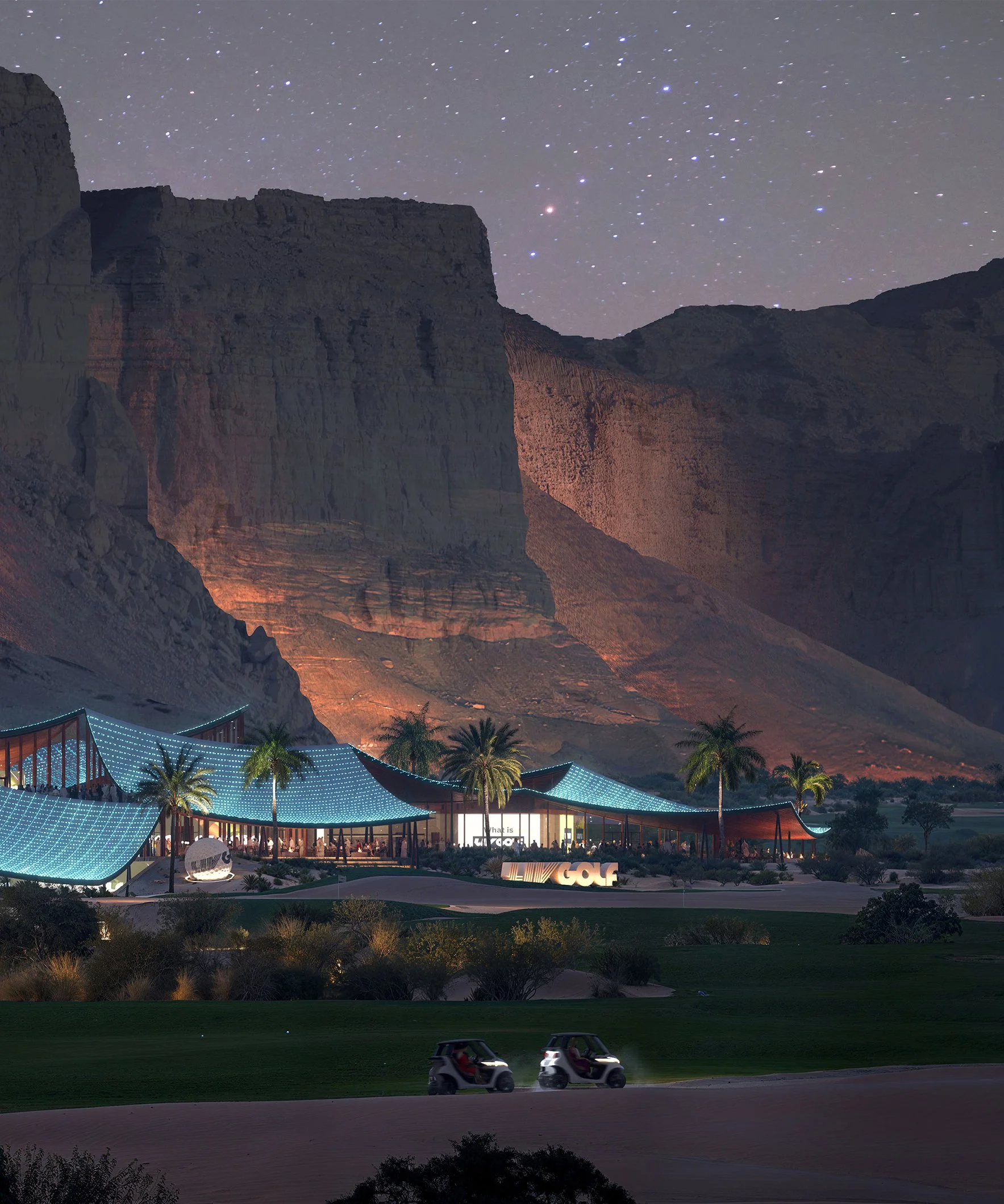 Nighttime view of a golf course with two golf carts in the foreground. In the background, there is a modern building with illuminated blue rooftops, palm trees, and a large cliff or mountain under a starry sky.