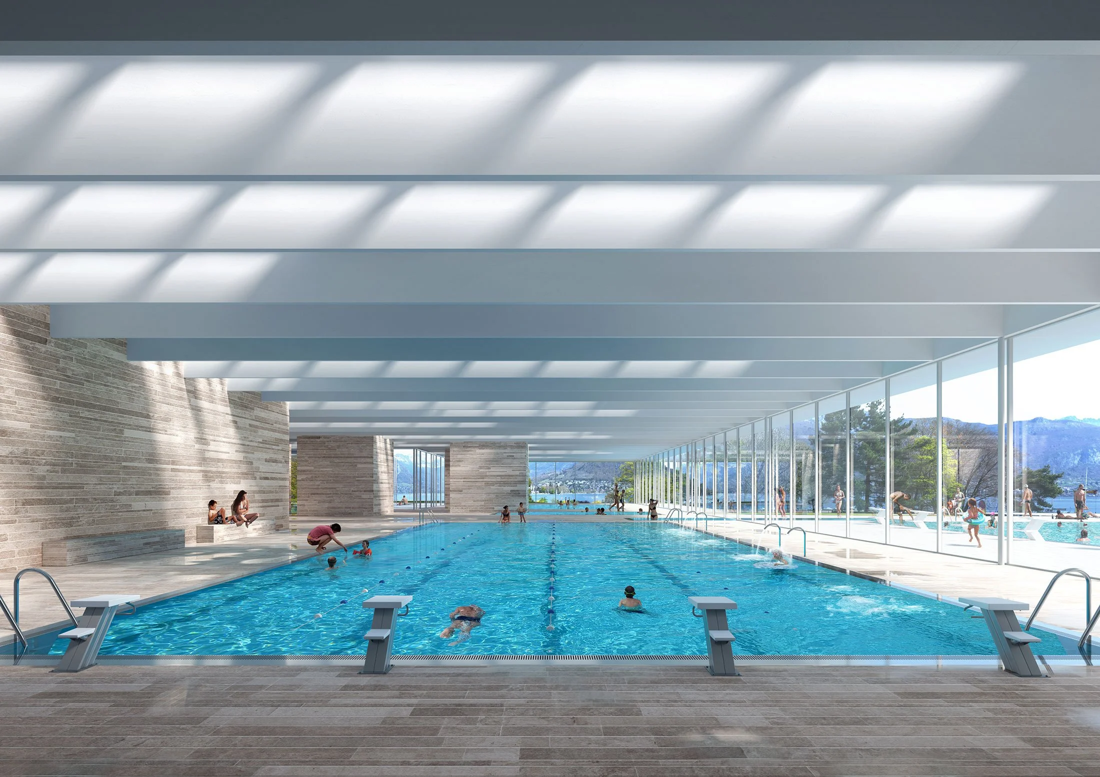 Indoor swimming pool with large glass windows showing an outdoor pool and mountains; swimmers and lifeguards present.