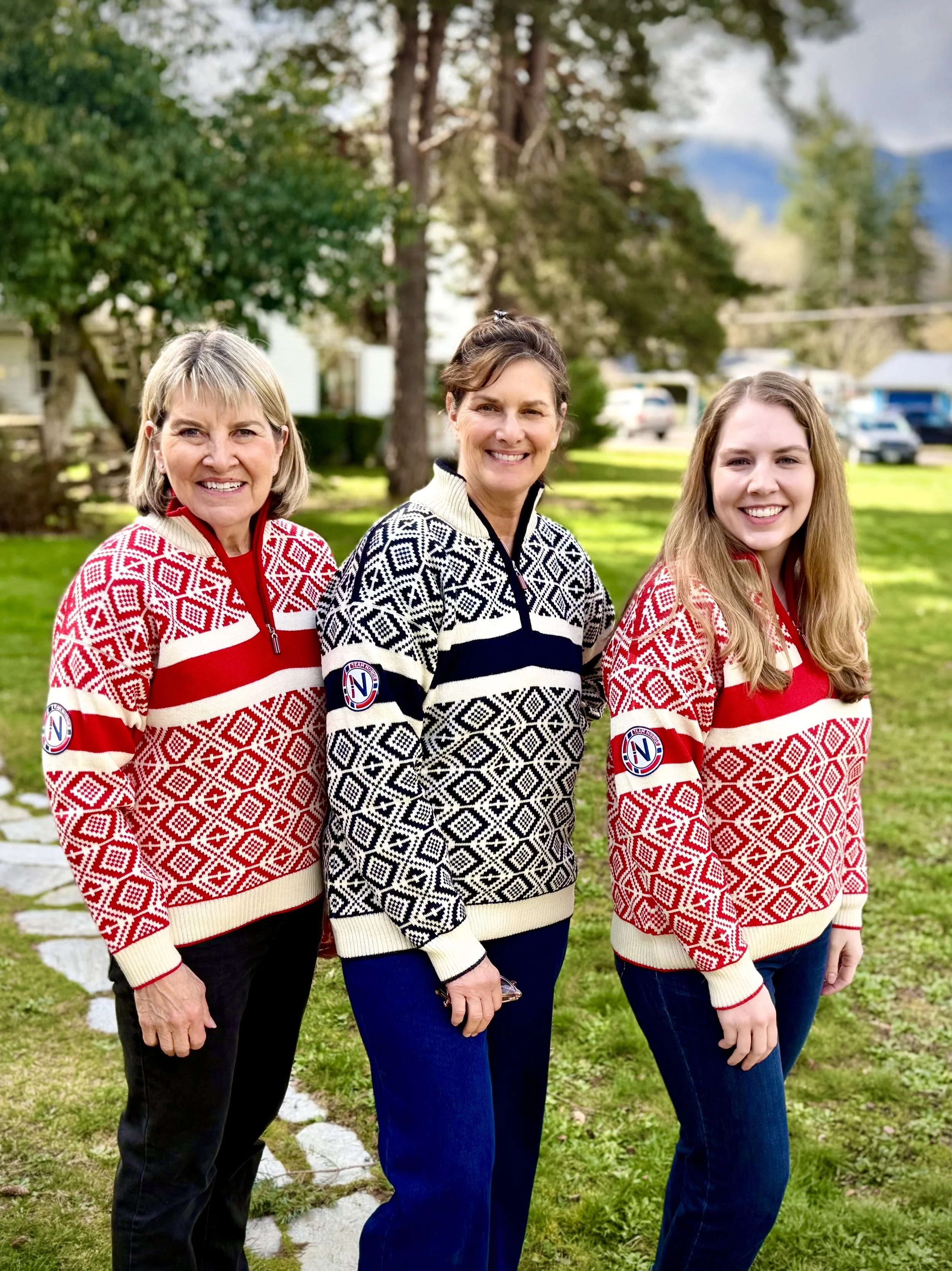 Sisters wearing the 2026 Winter Olympics Norwegian sweater