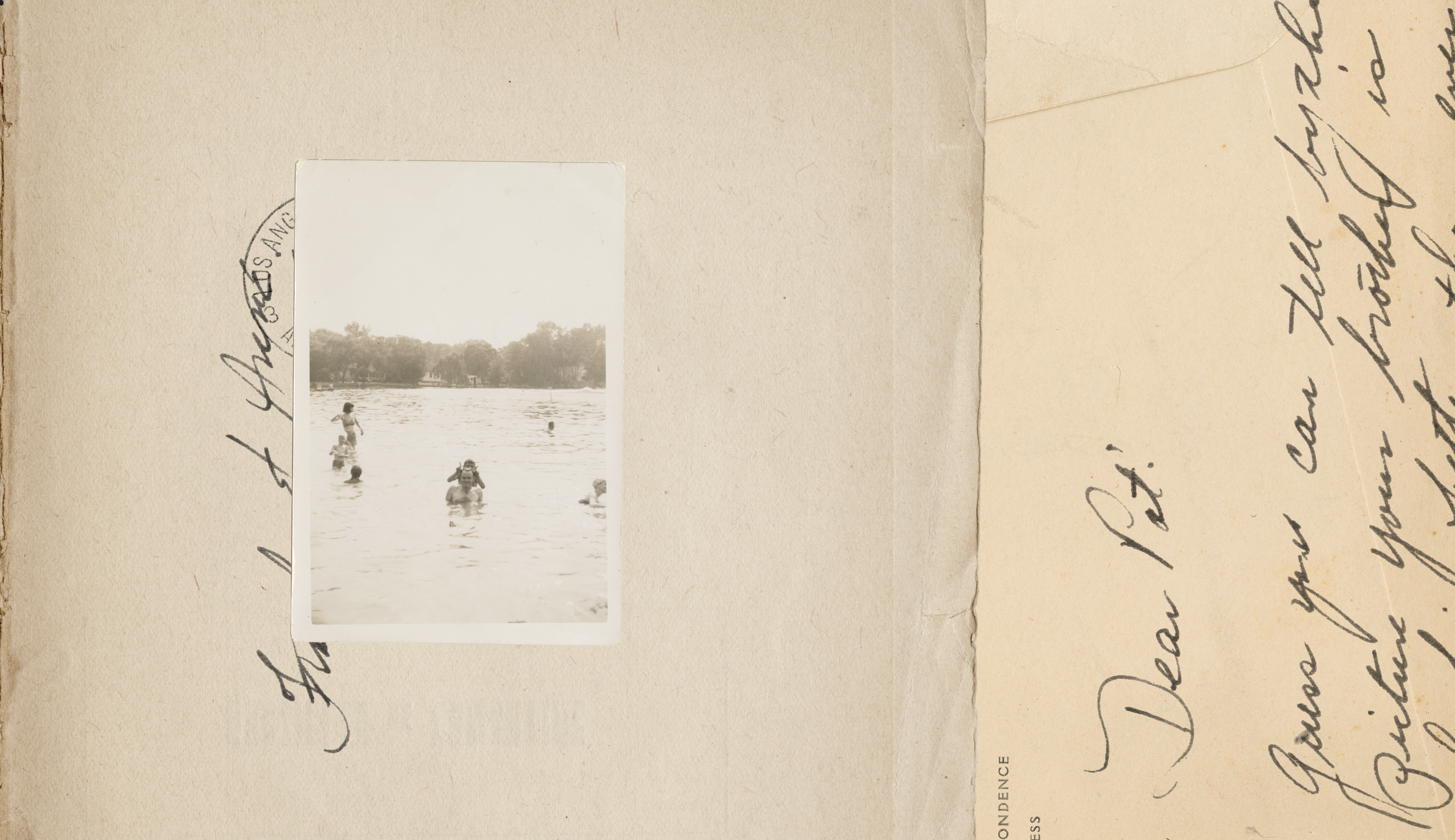 A vintage black-and-white photograph of children swimming and playing in a river, with trees and houses visible in the background, attached to a handwritten letter on aged paper.