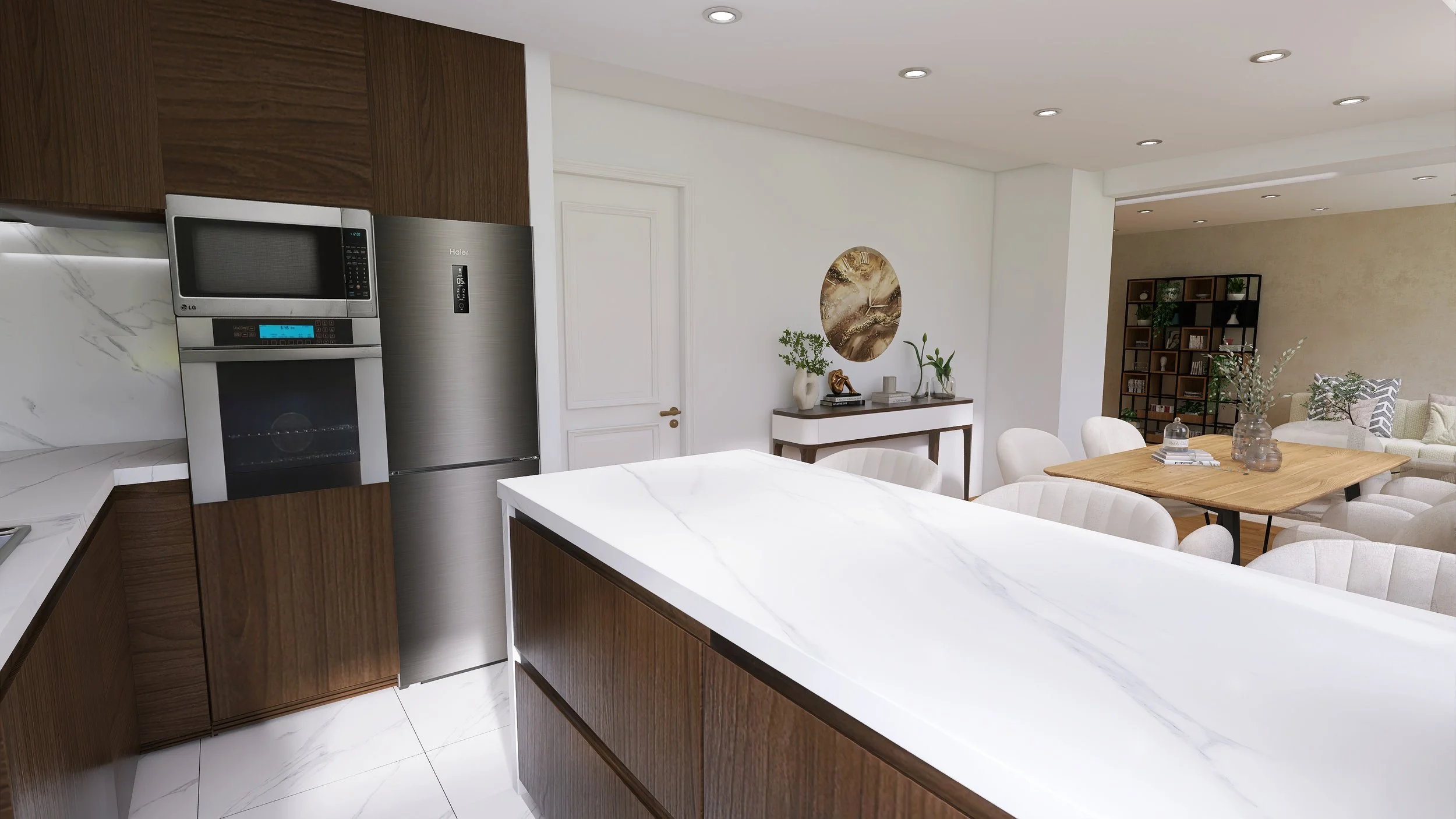 Modern open-plan kitchen and dining area with white walls, wooden cabinetry, marble island, stainless steel refrigerator, microwave, and oven, adjacent to a living space with a bookshelf and cozy seating.