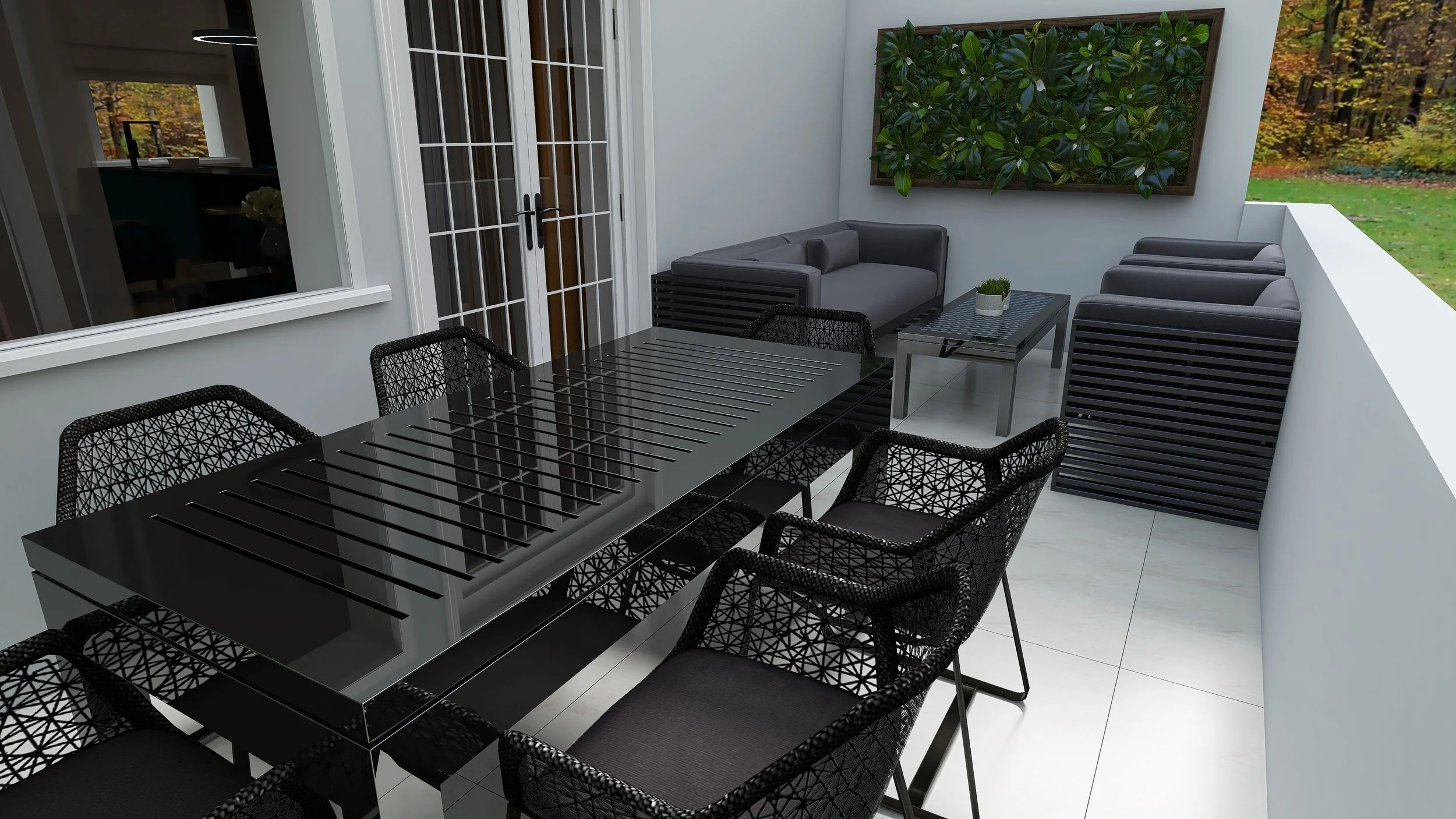 Modern outdoor patio with black glass dining table and six black woven chairs, gray cushioned sofa, matching armchairs, black coffee table with small potted plant, green wall art, French doors, and white walls, overlooking a yard with trees.