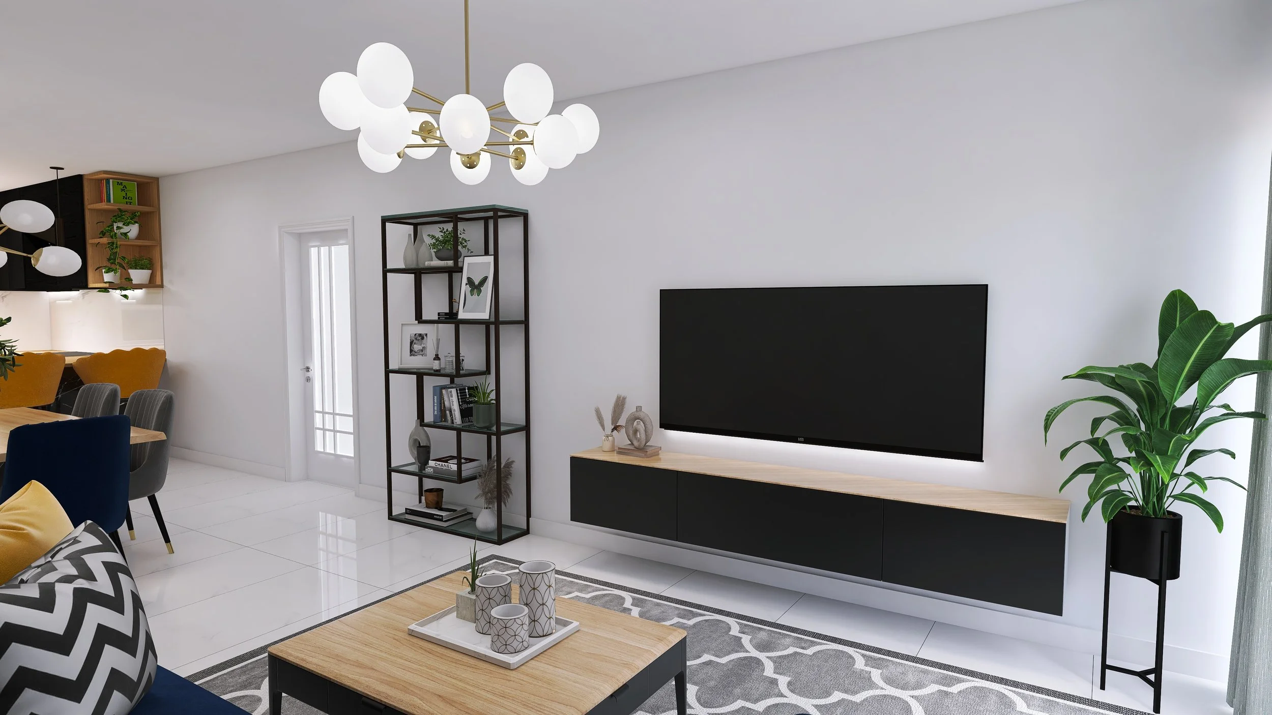Modern living room with a large wall-mounted television, black and wooden media console, a tall black shelving unit with decorative items, a large potted plant, and a wooden coffee table with candles and a tray, decorated in neutral tones with accents of color.