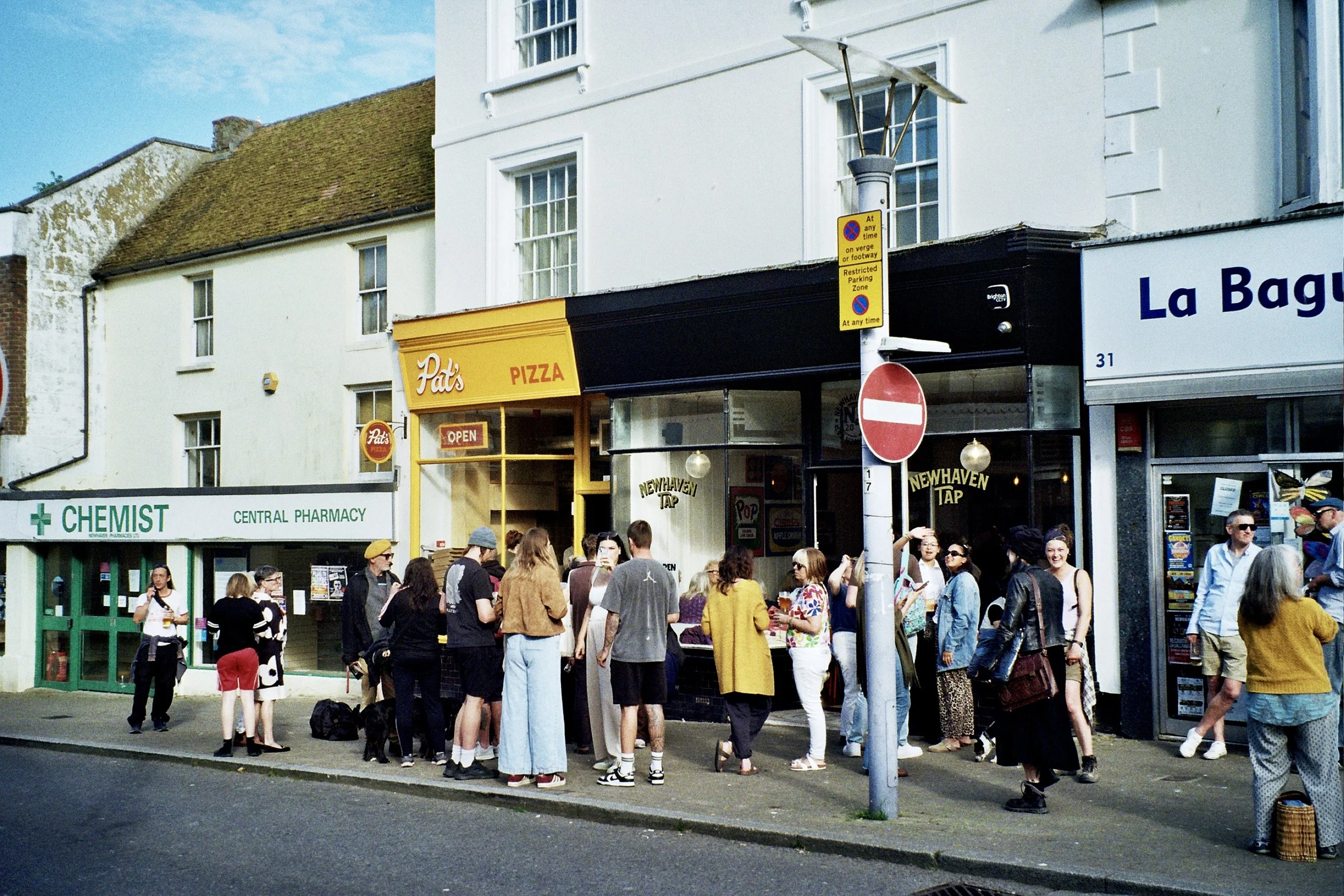 Newhaven High Street outside Pat's Pizza and La Baguette Shop