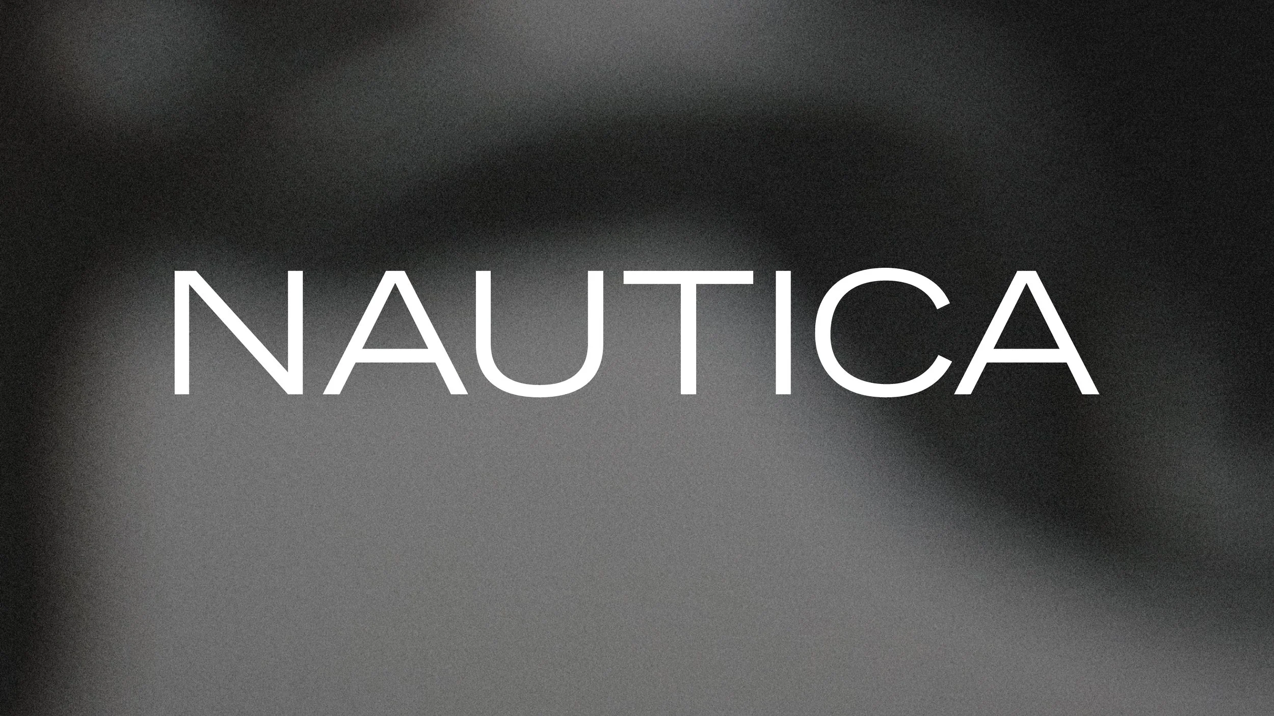 The word NAUTICA written in white text on a gradient background.