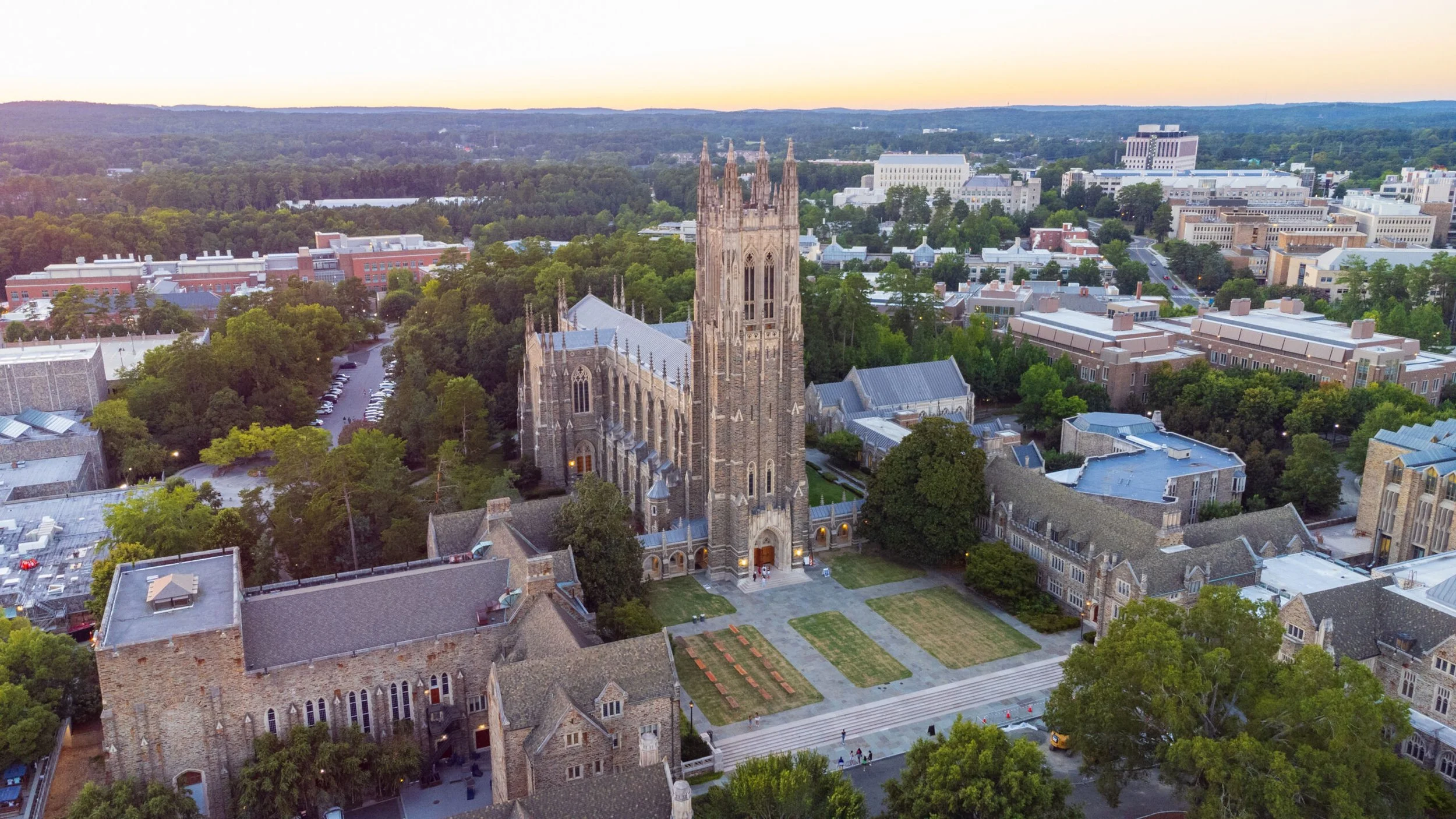 Sunset over Duke University campus with a prominent spire, reflecting the global academic opportunities and strategic mentorship provided by Vancouver-based Bricks to Stone Education.