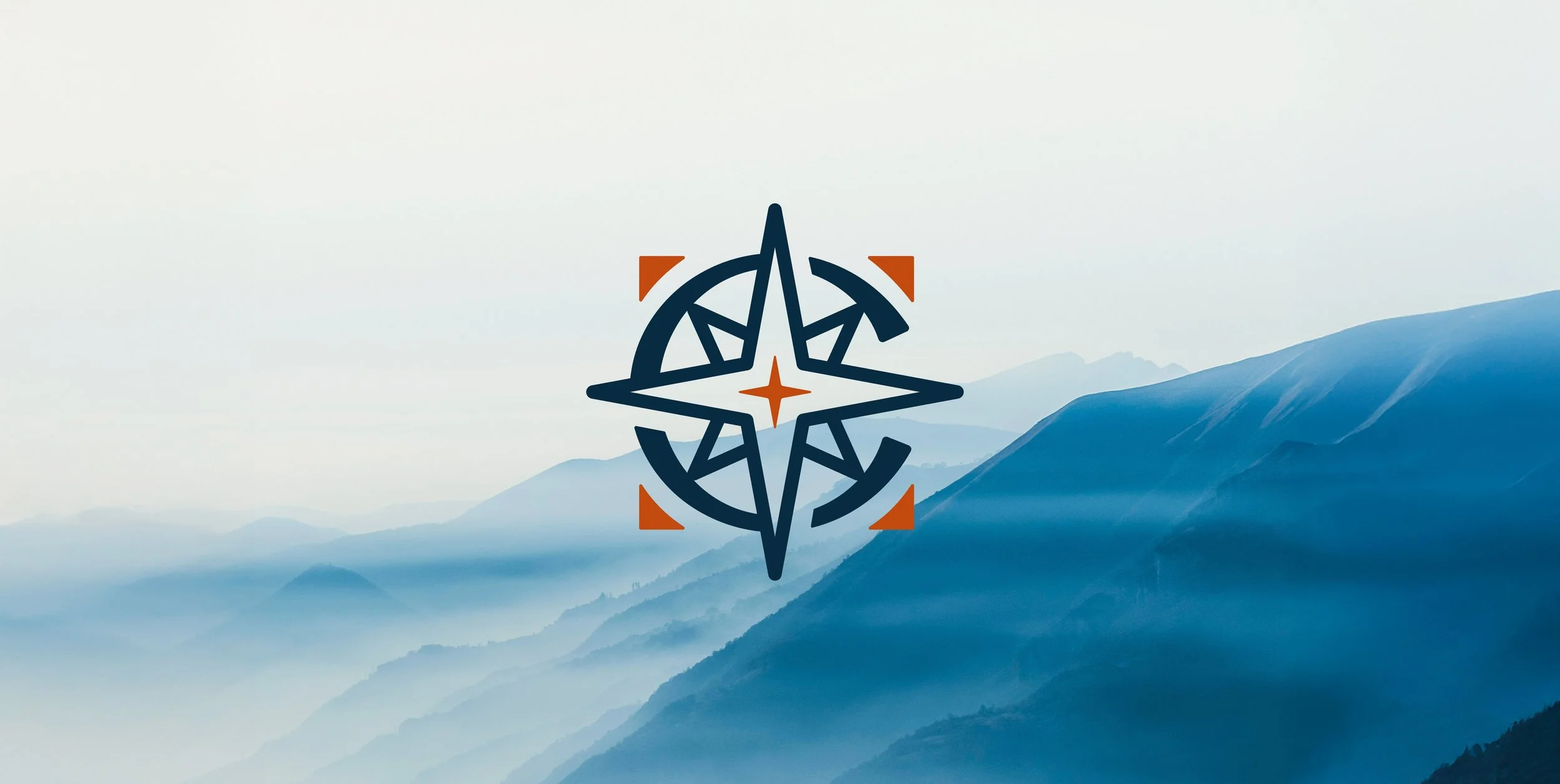 Overlapping logo of a stylized compass rose with a circular C around it, featuring dark blue and burnt orange colors, with mountain landscape in the background.