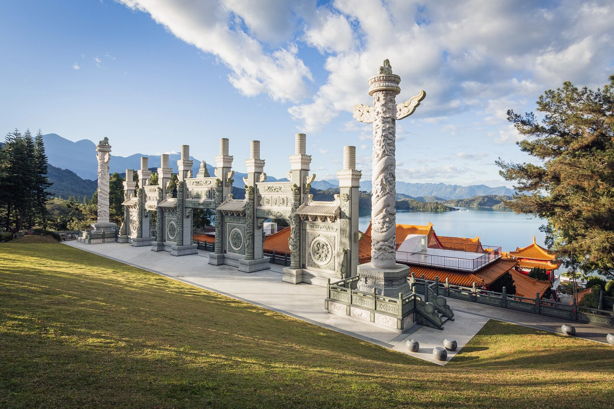 A waterfront destination wedding venue featuring antique columns, with high-end wedding photography by Cécile Wedding
