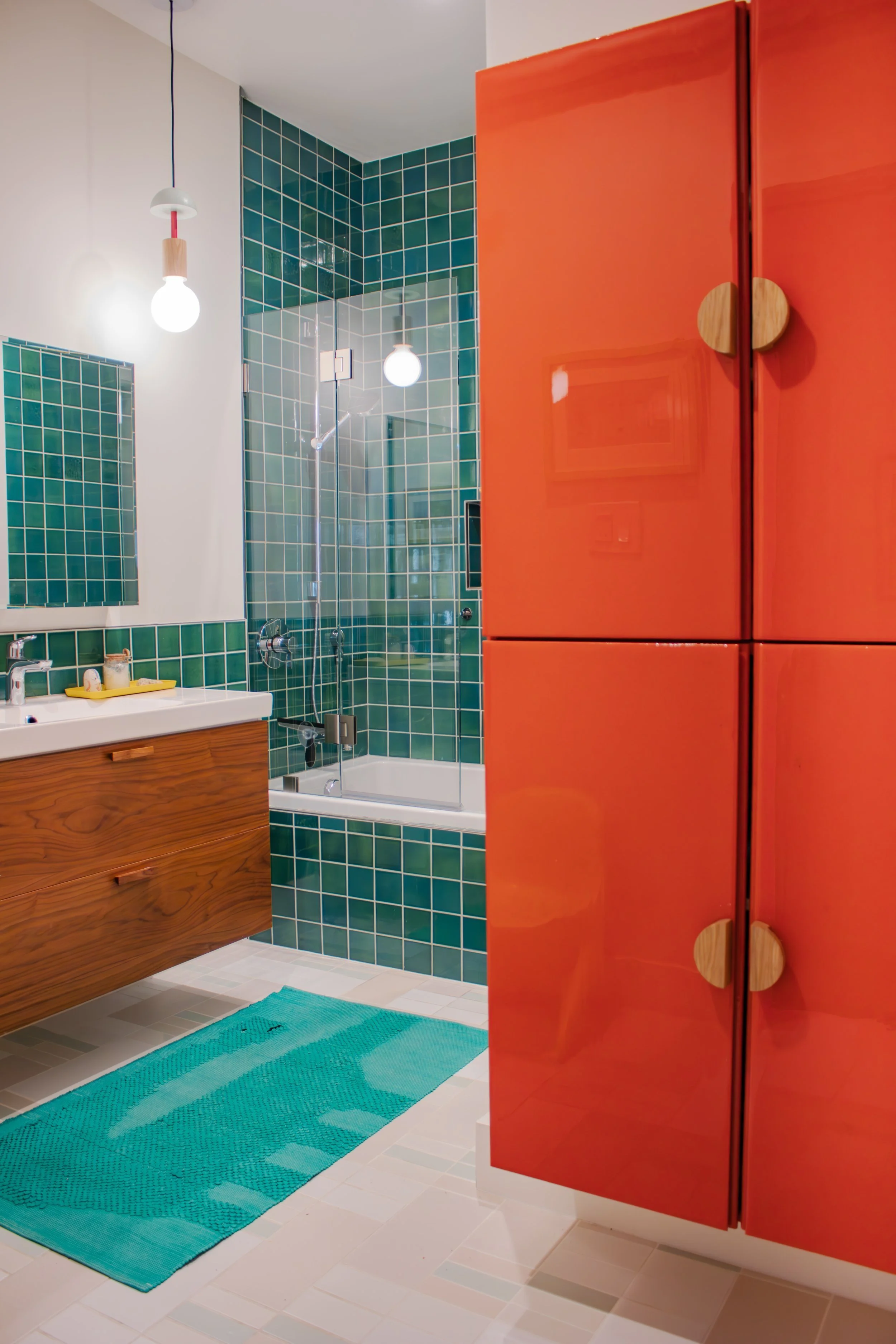 Two IKEA Ivar pine cabinets painted, resined, and mounted on the wall create fun and ample storage. 

Tile: Heath Overstock Shed
Construction: Hyperion Design and Build