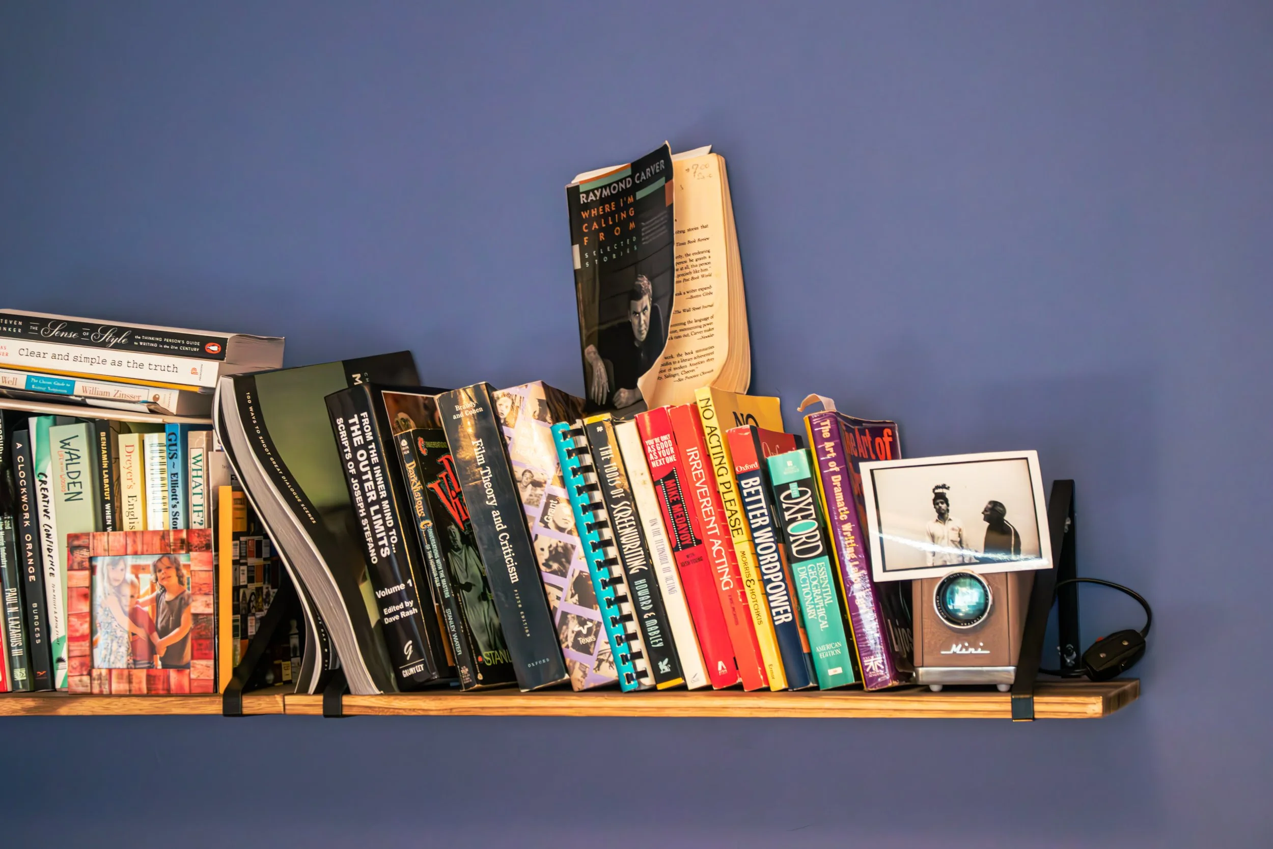 The saturated tones of Farrow and Ball's Pitch Blue give this office space a warm and inviting feel.  