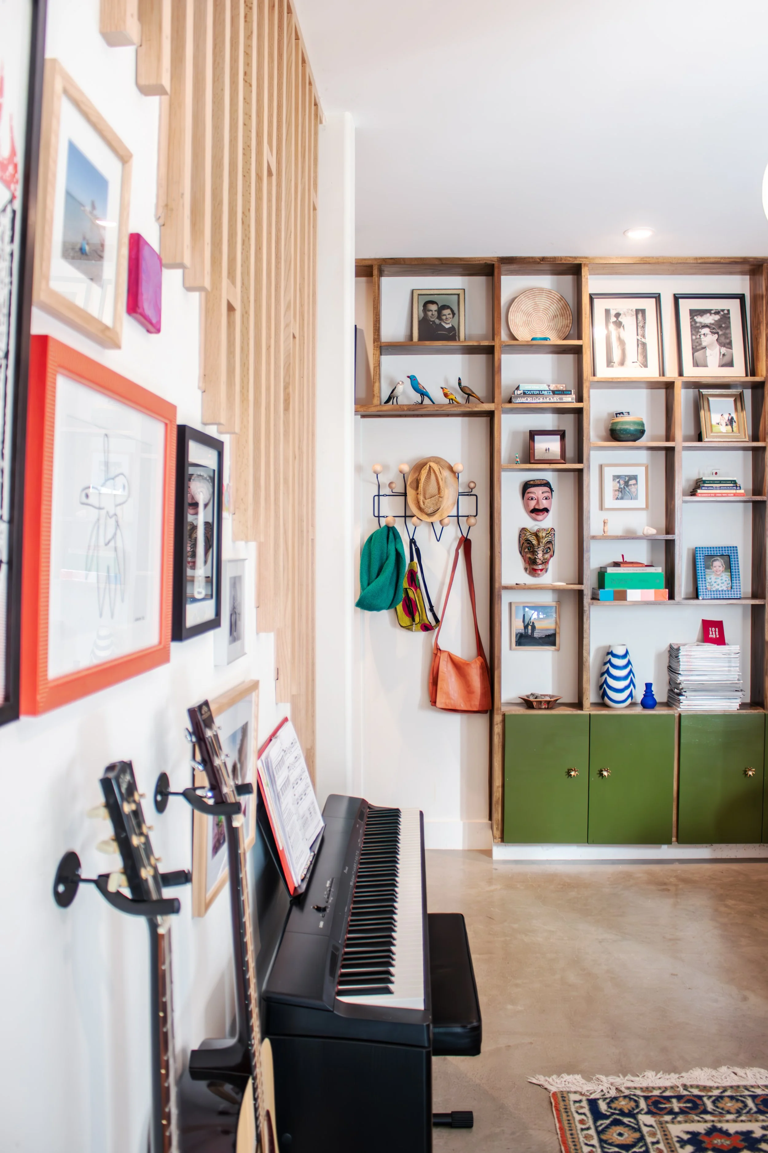 Custom built in storage is functional and becomes a feature wall to showcase photos and artifacts.  

Construction: Hyperion Design and Build