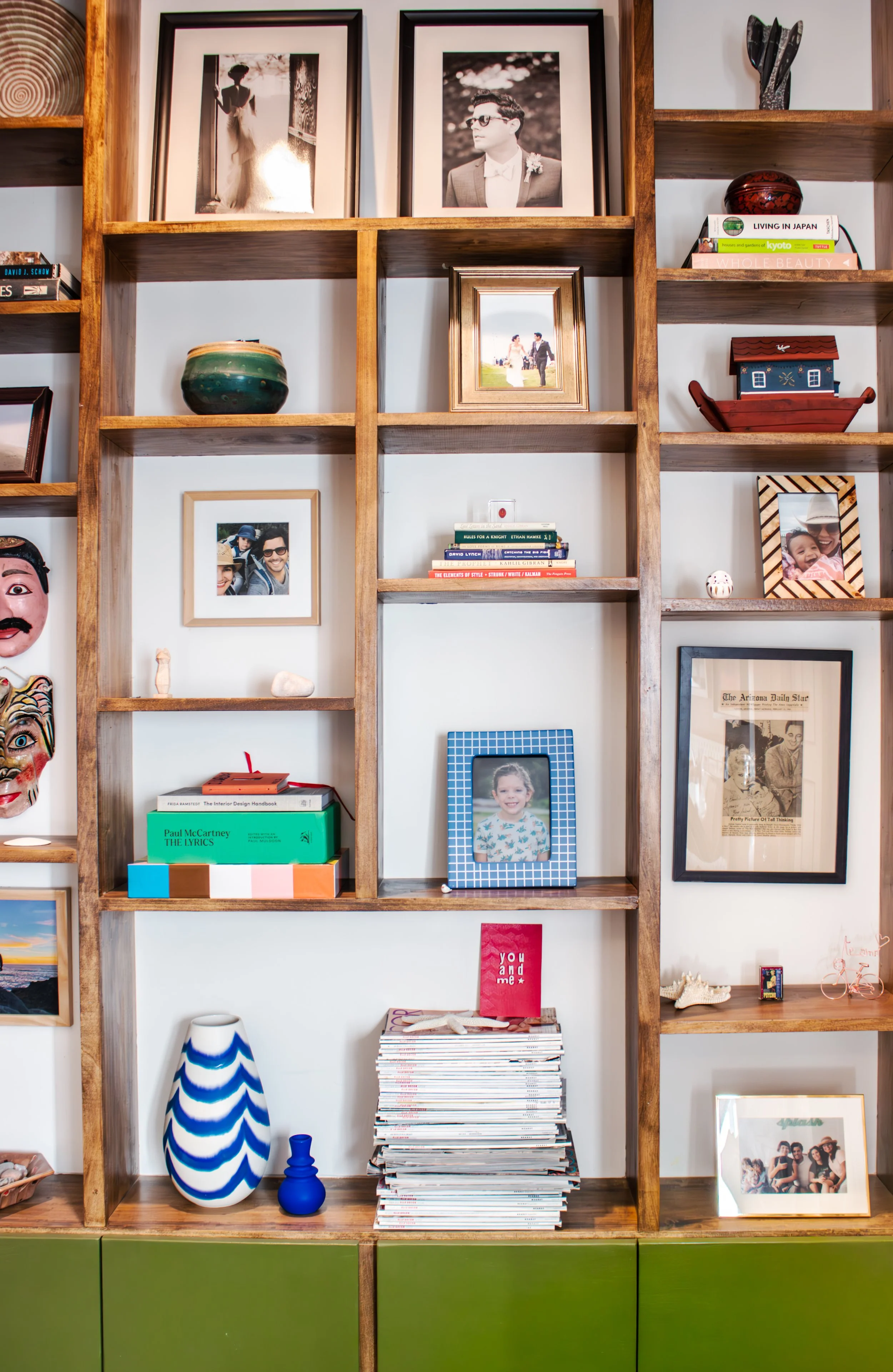 Custom built in storage is functional and becomes a feature wall to showcase photos and artifacts.  

Construction: Hyperion Design and Build