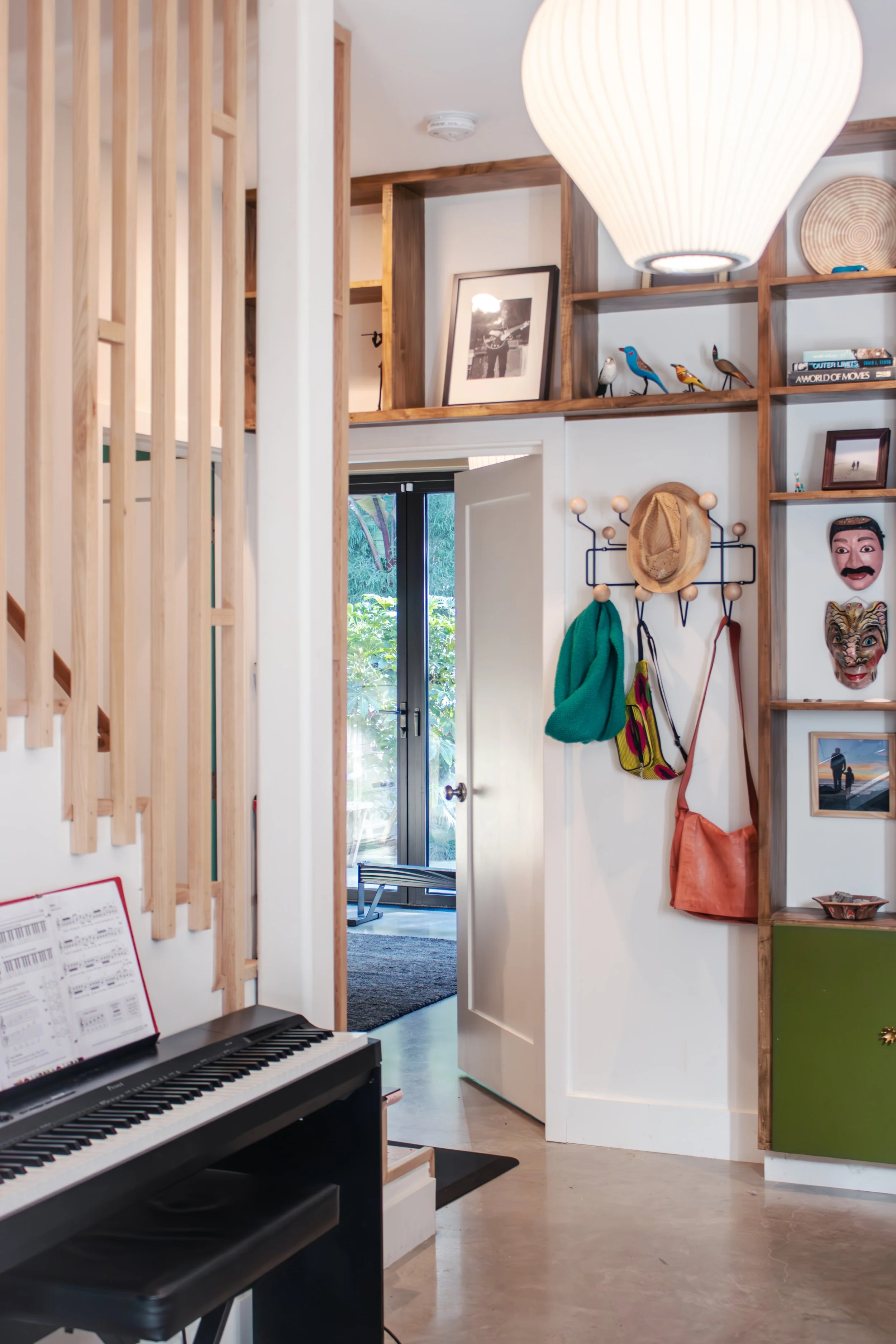 Custom built in storage is functional and becomes a feature wall to showcase photos and artifacts.  

Construction: Hyperion Design and Build