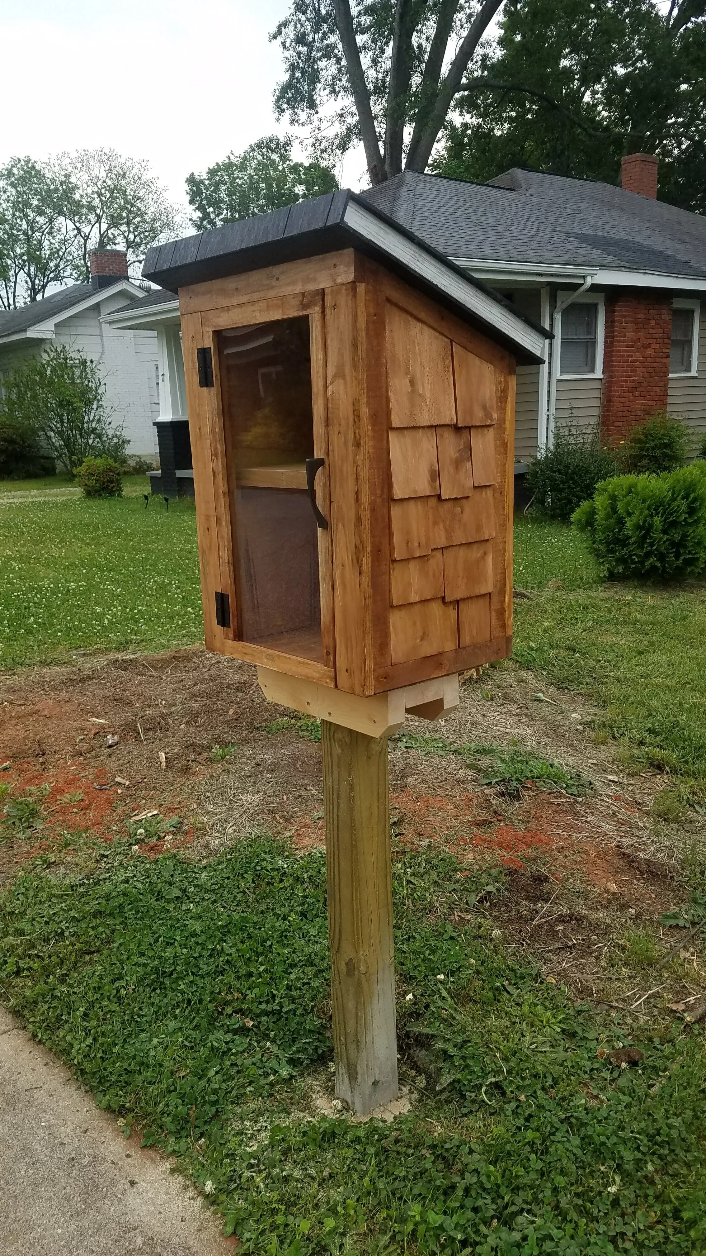 Little Free Library designed with a book inspired roof