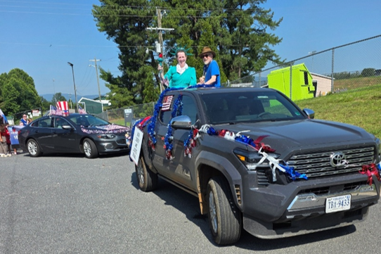 Lady Liberty and Music Man John in Truck 2 folowed by our personal Rescue vehicle!