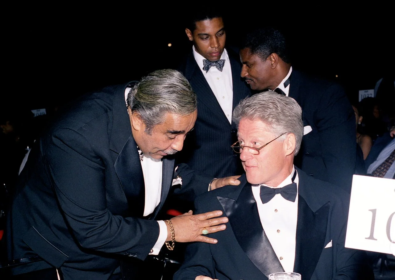 Representative Charles Rangel of NY confers with President Bill Clinton at the CBC Dinner.  Rangel was one of the original members of the Congressional Black Caucus.
