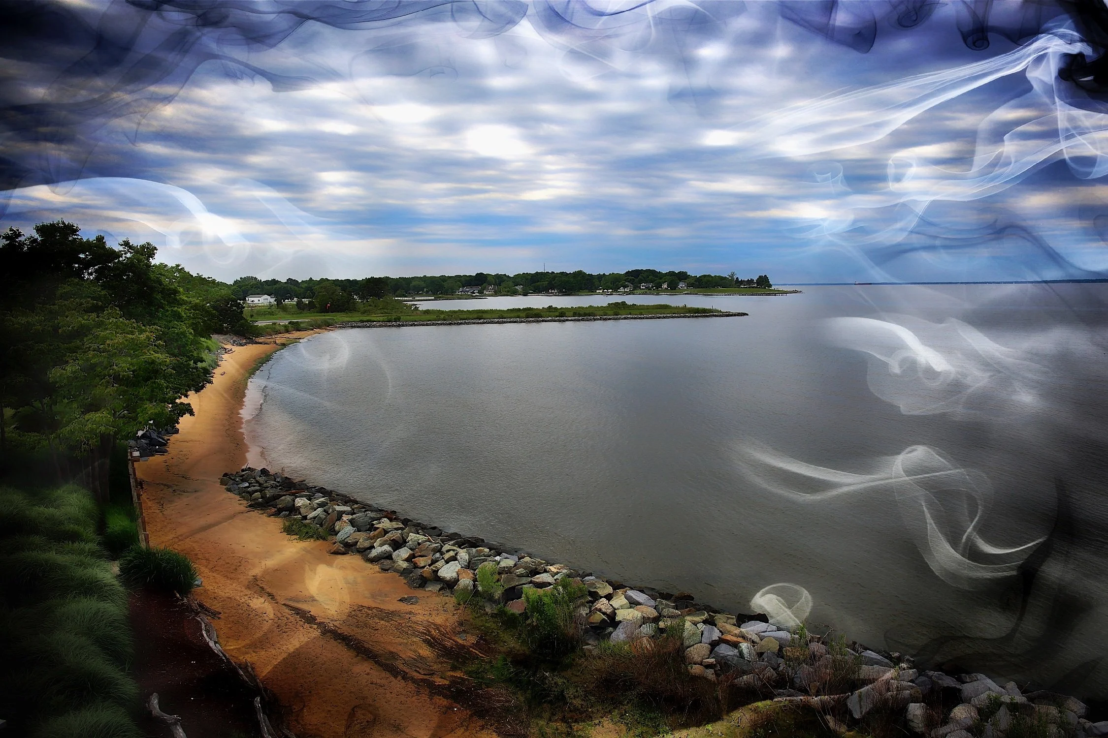 A lakeside scene of Chesapeake Bay with a sandy beach, rocks, green trees, and a cloudy sky, with some smoke or mist effect overlay.