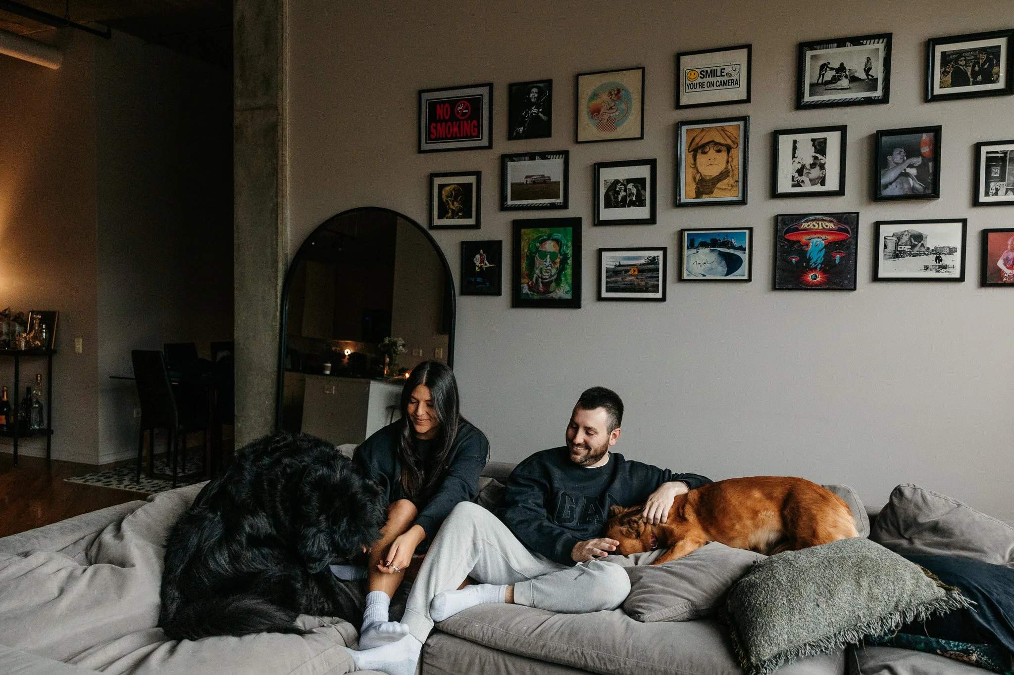 Chicago couple with their dogs on the couch at home