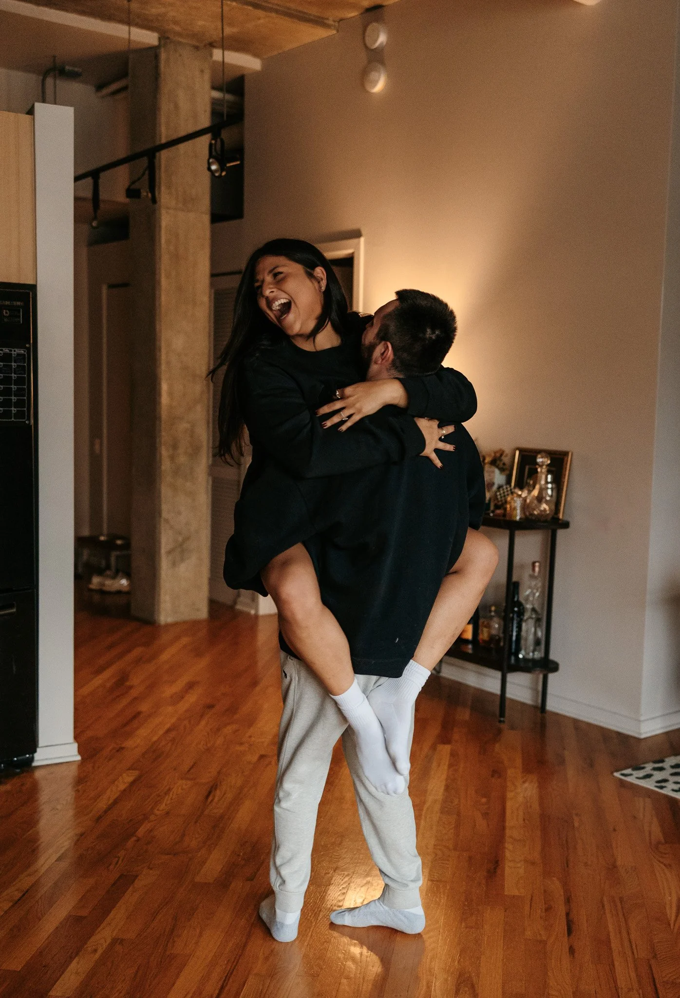 couple dancing in kitchen in pajamas