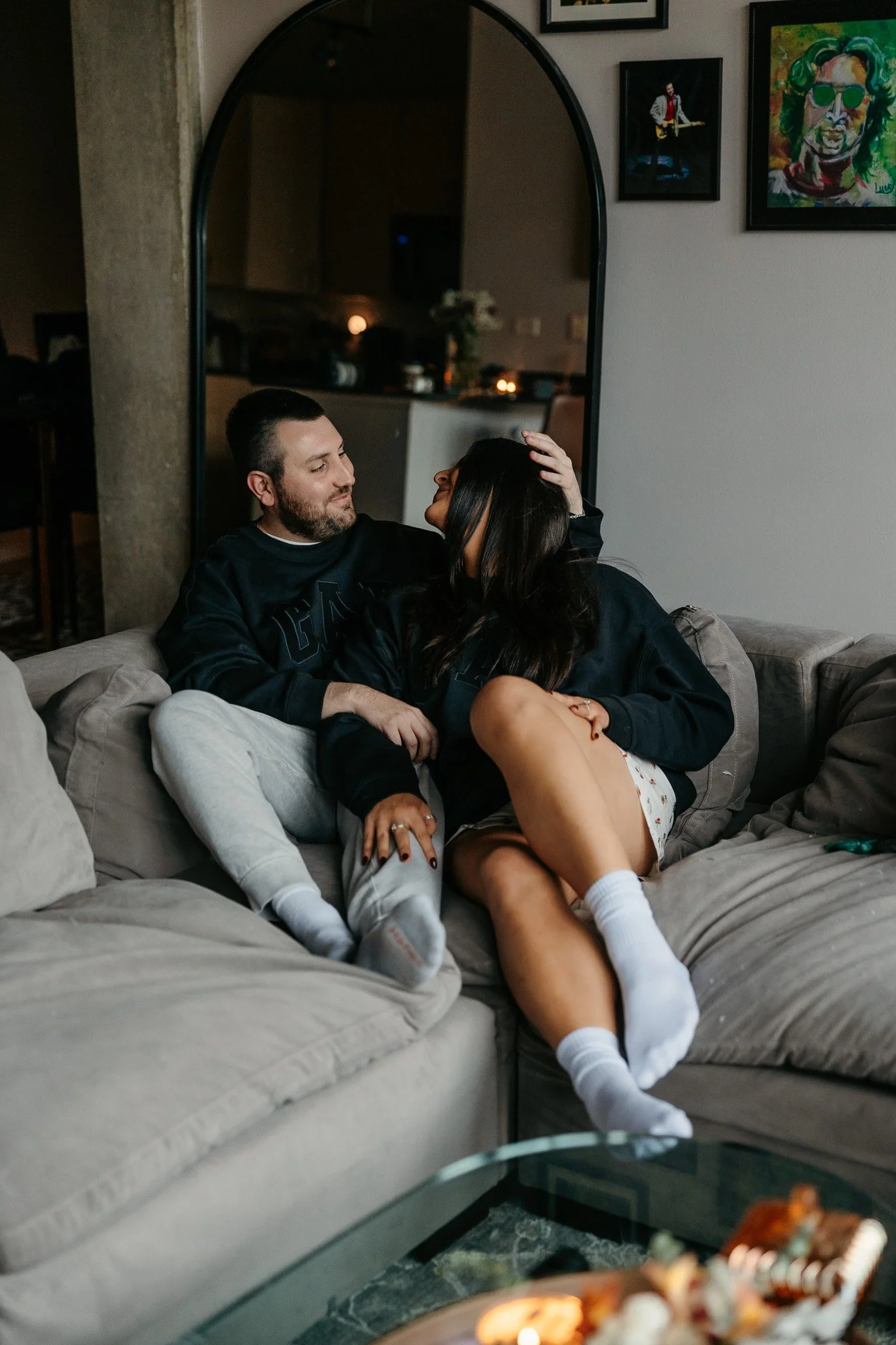 Chicago couple relaxing on the couch in pajamas