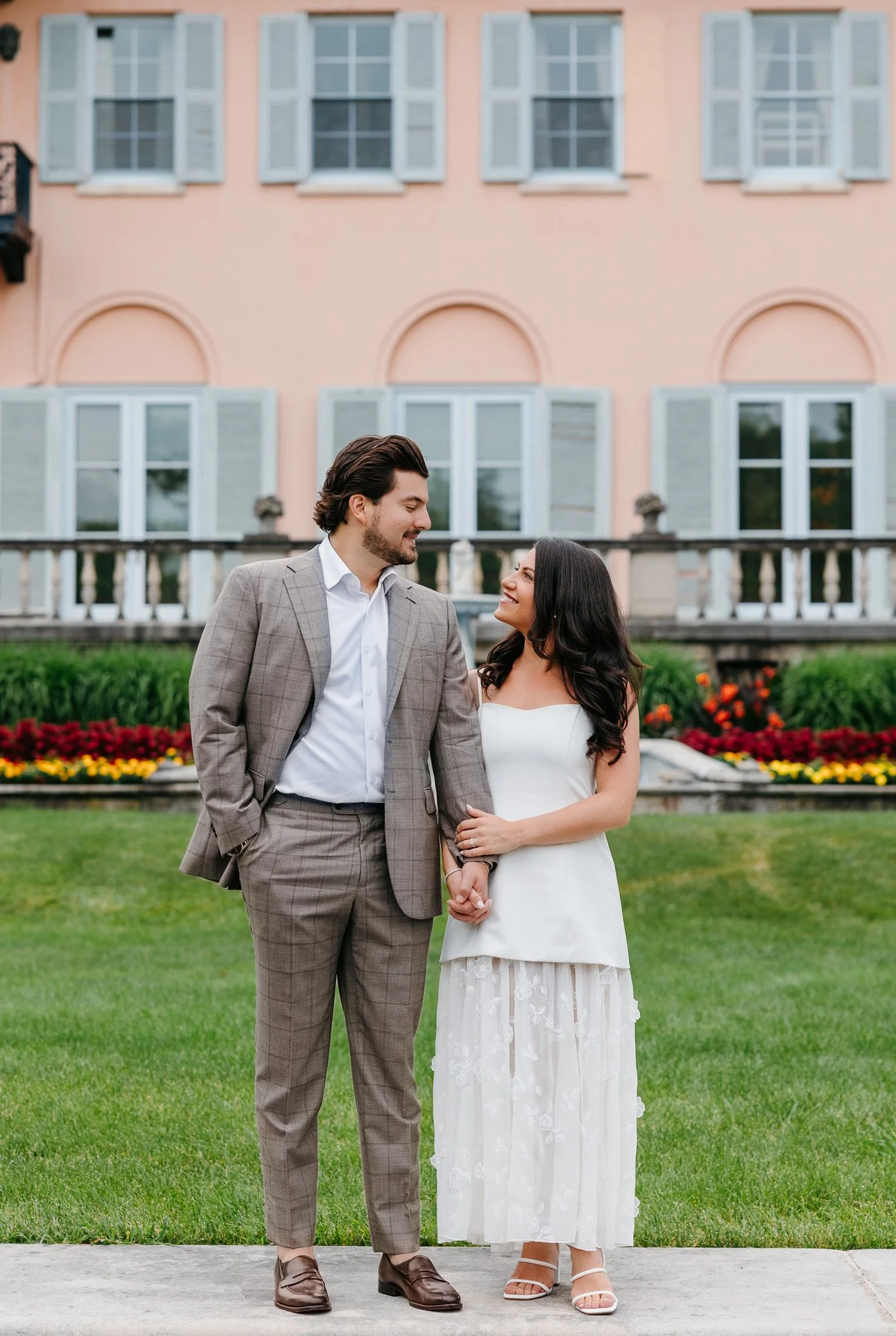 Elegant engagement portraits in the gardens of Cuneo Mansion, blending modern digital and timeless film photography.