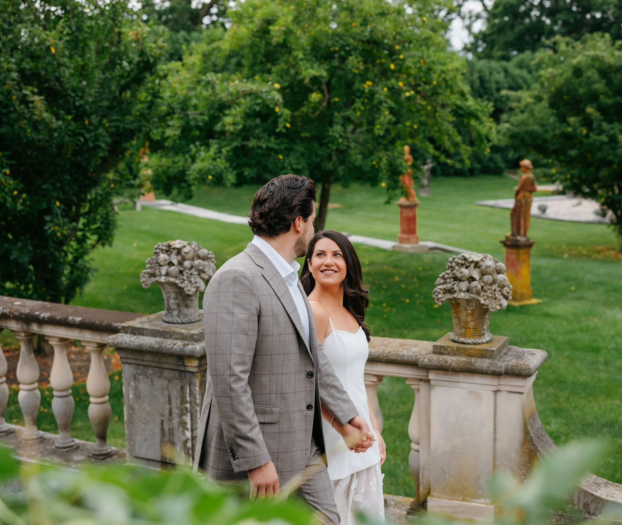 couple walking in italian garden cuneo mansion