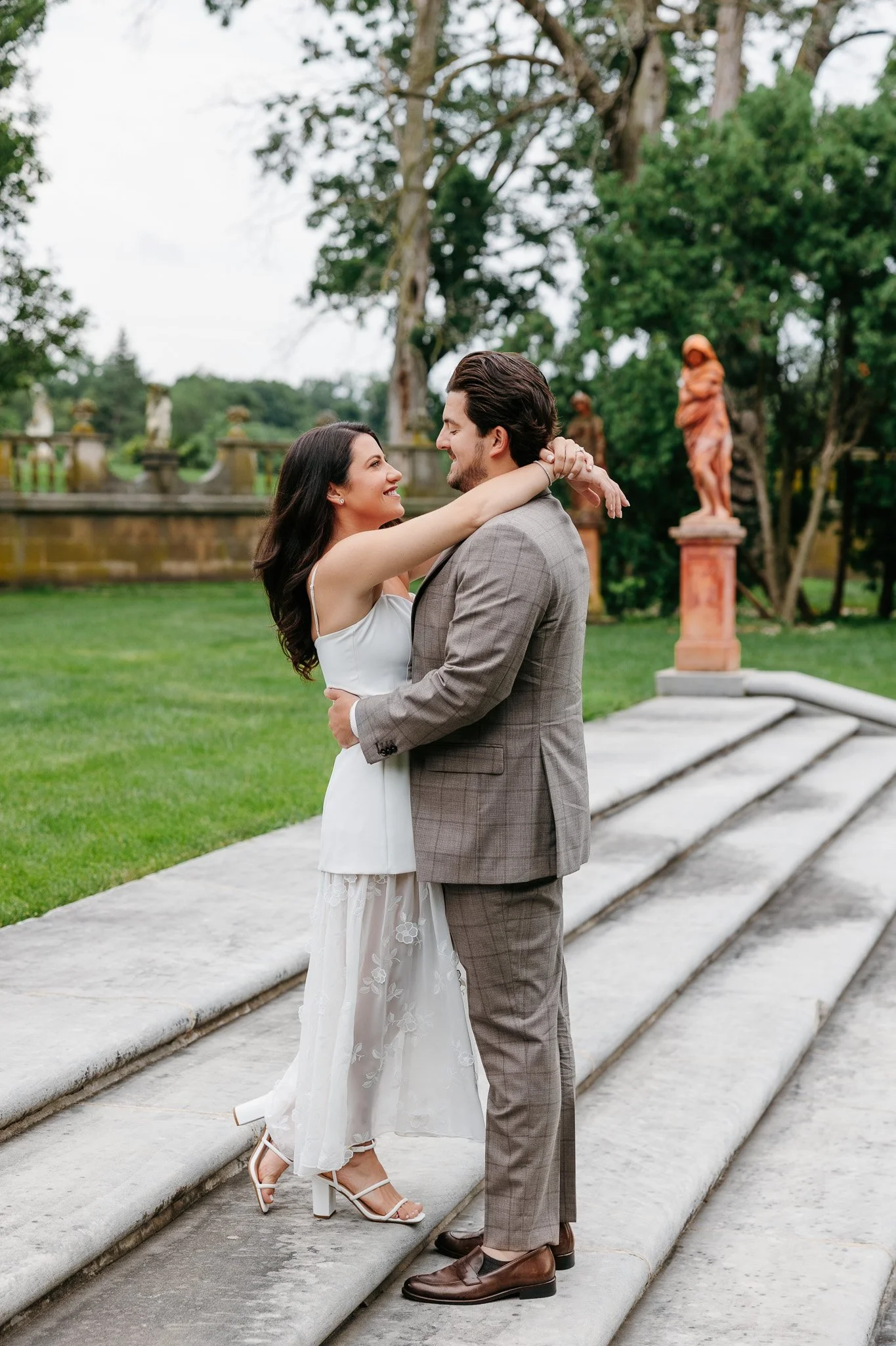 Couple’s joyful engagement session at Cuneo Mansion in Vernon Hills with a documentary-inspired film photo.