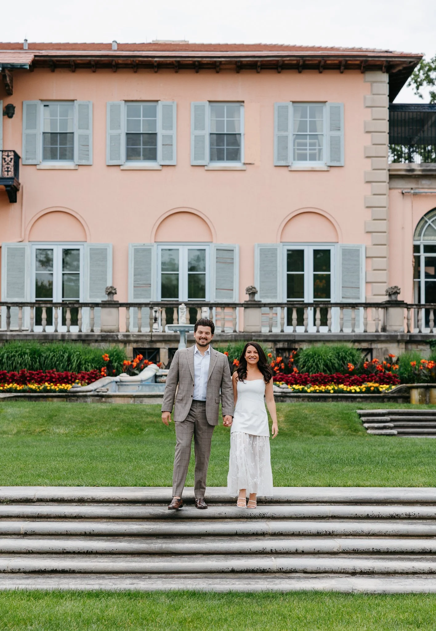 Couple laughing together during their Cuneo Mansion engagement session near Chicago, photographed in digital and film.