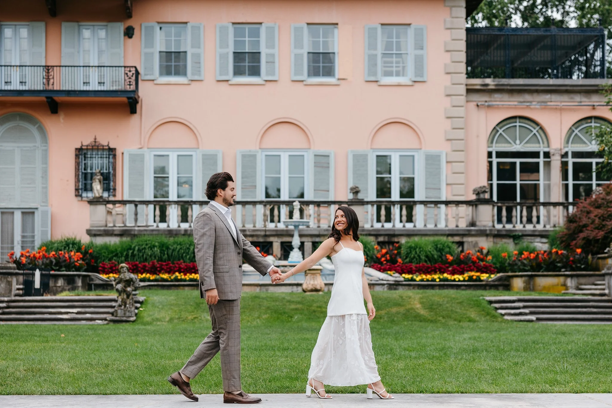 Couple laughing together during their Cuneo Mansion engagement session near Chicago, photographed in digital and film.