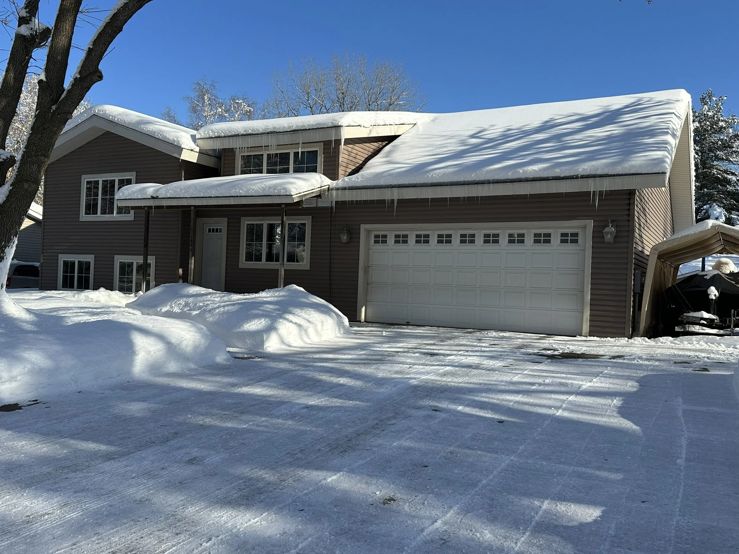 residential house with ice dams on roof