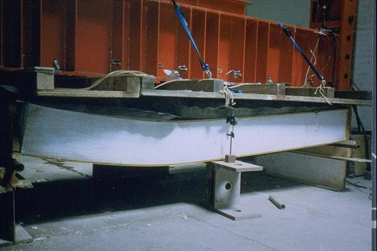 Structural insulated panel undergoing flexural load testing to evaluate bending strength and structural performance