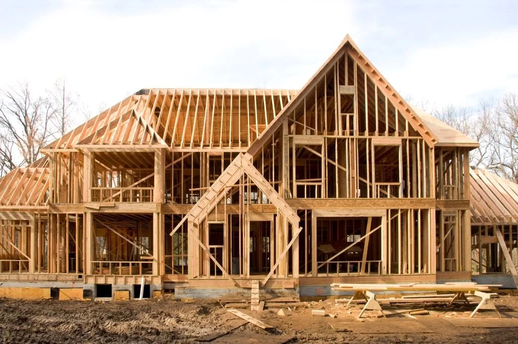 Traditional 2x6 stud wall framing showing gaps for batt insulation between studs.