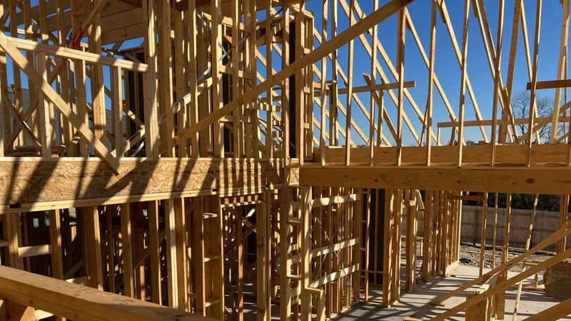 Conventional stick-grame wall construction with 2x6 dimensional lumber studs and open insulation cavities