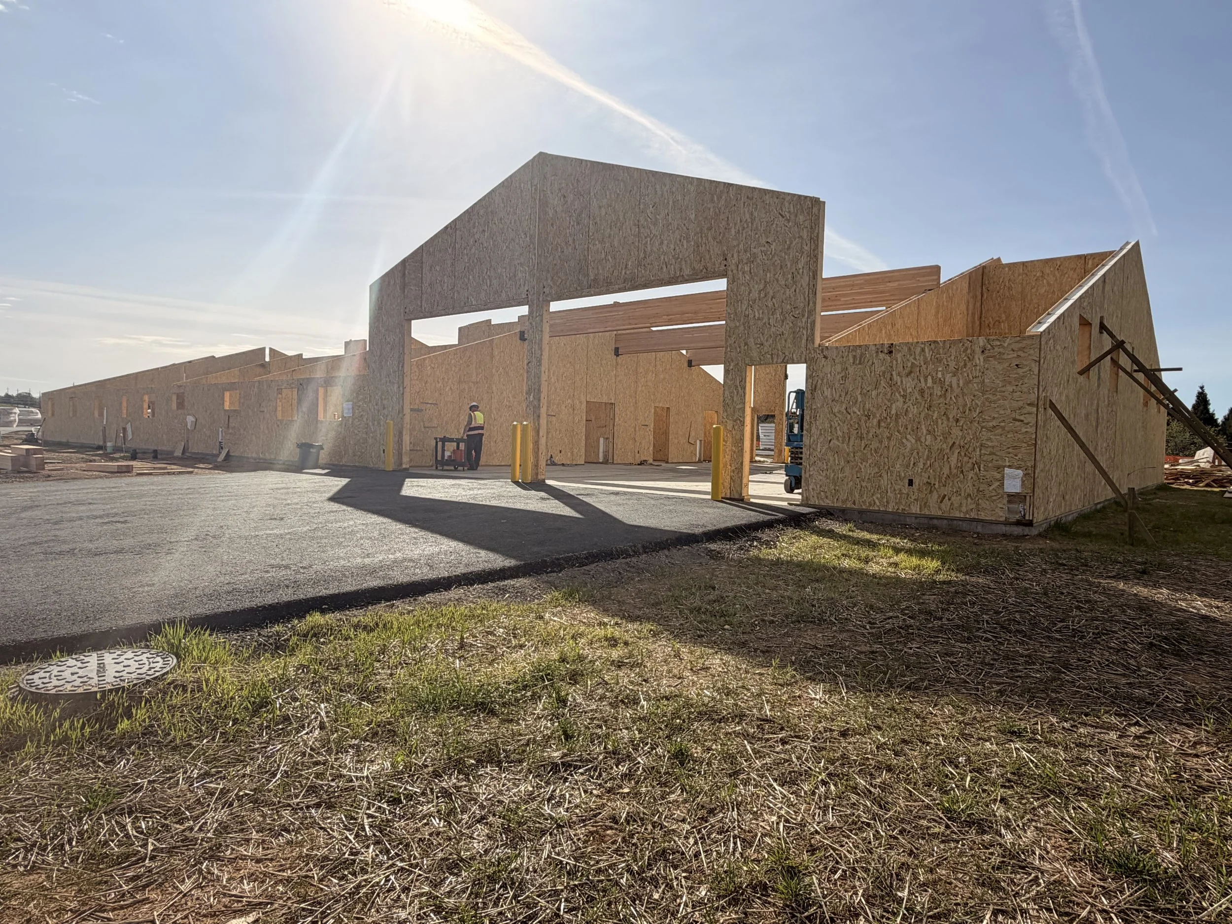 Structural Insulated Panel building under construction showing SIP wall panels installed before roof assembly