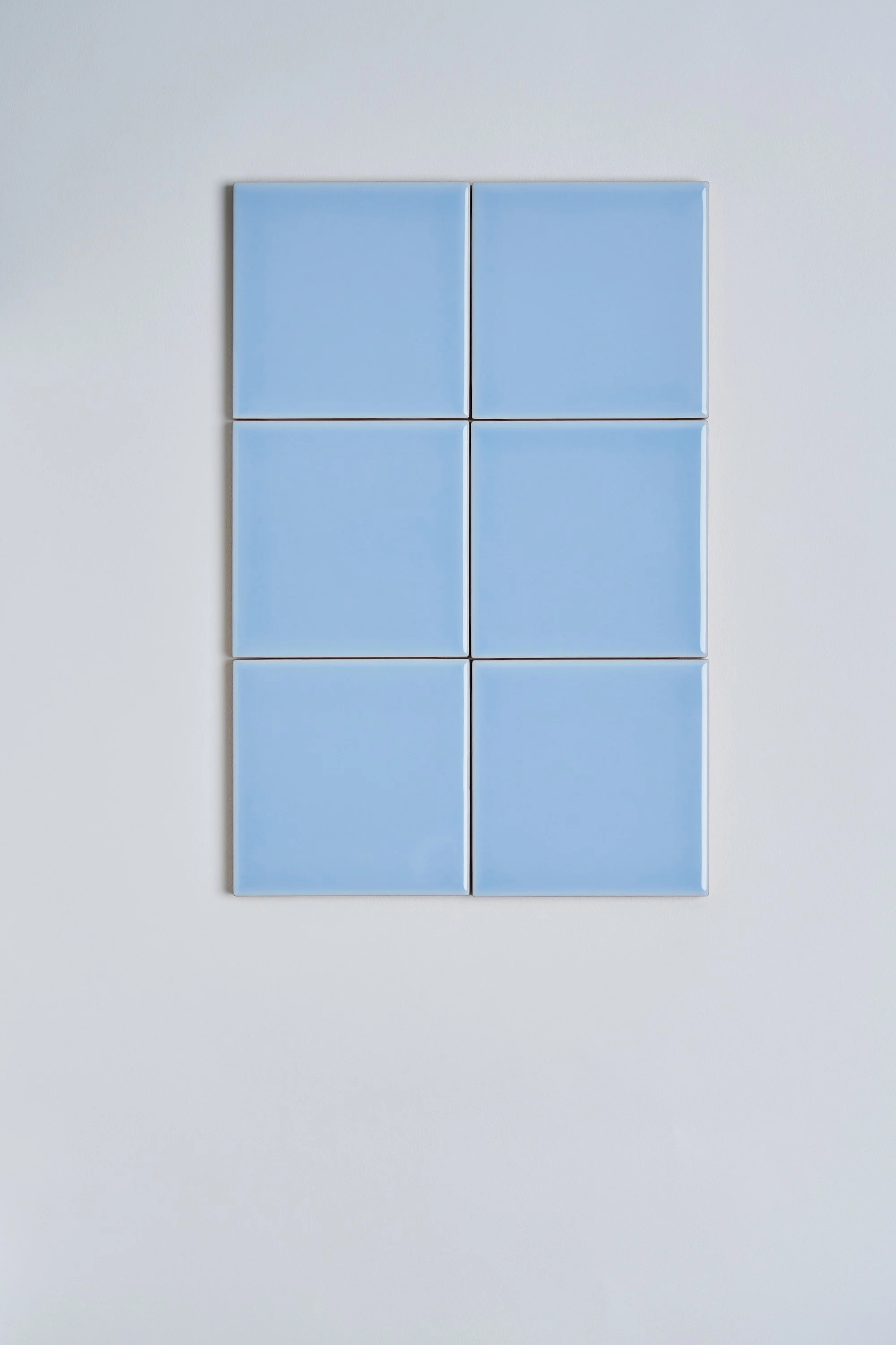 patial design details. A composition of six blue square tiles illustrating material choices for curated interiors. An example of Italian terracotta tiles YVONNE KONÉ made in collaboration with Bleō.