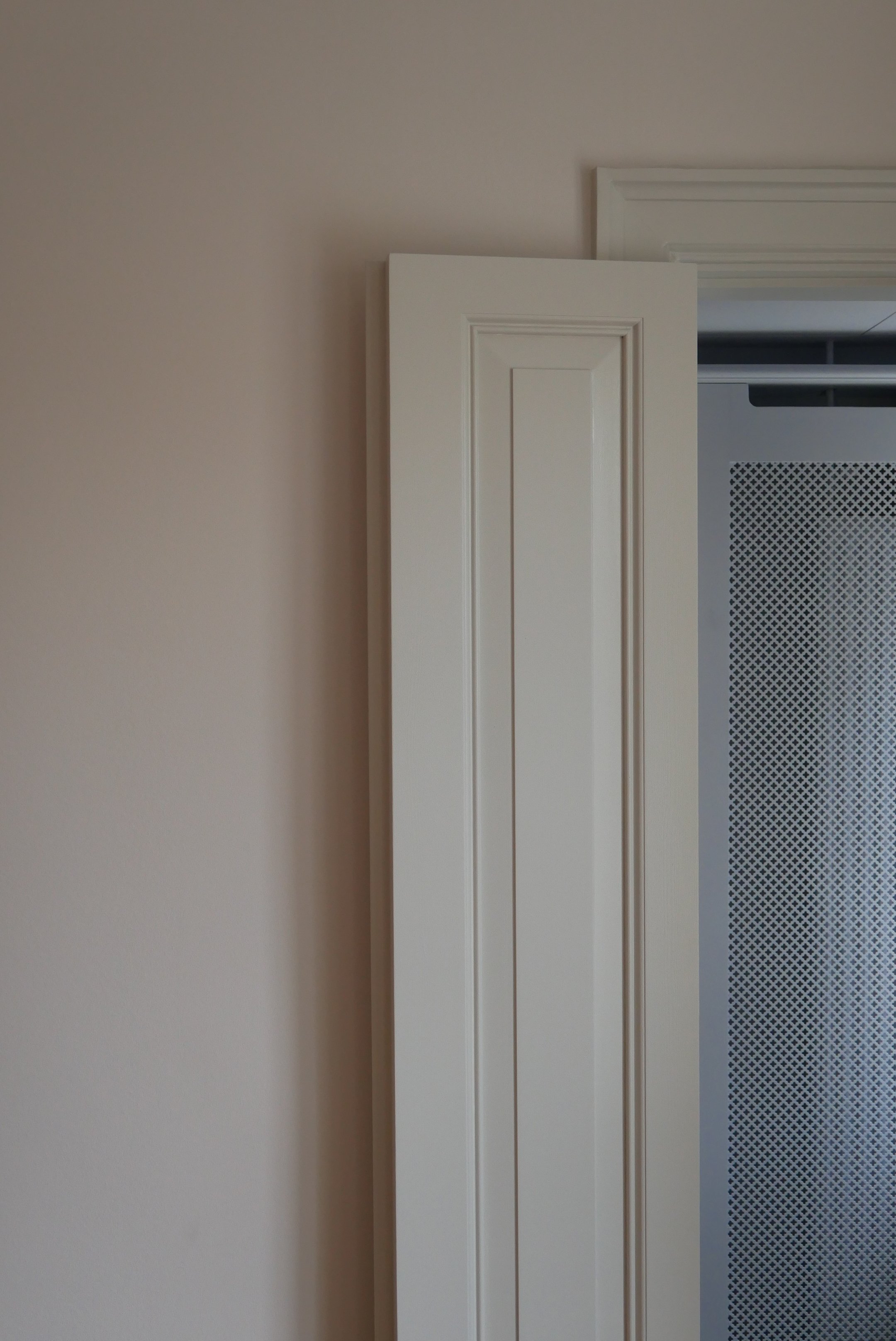 Custom made double door made to measure for a space not suitable for a standard door size. A bespoke architectural solution designed by Yvonne Koné.