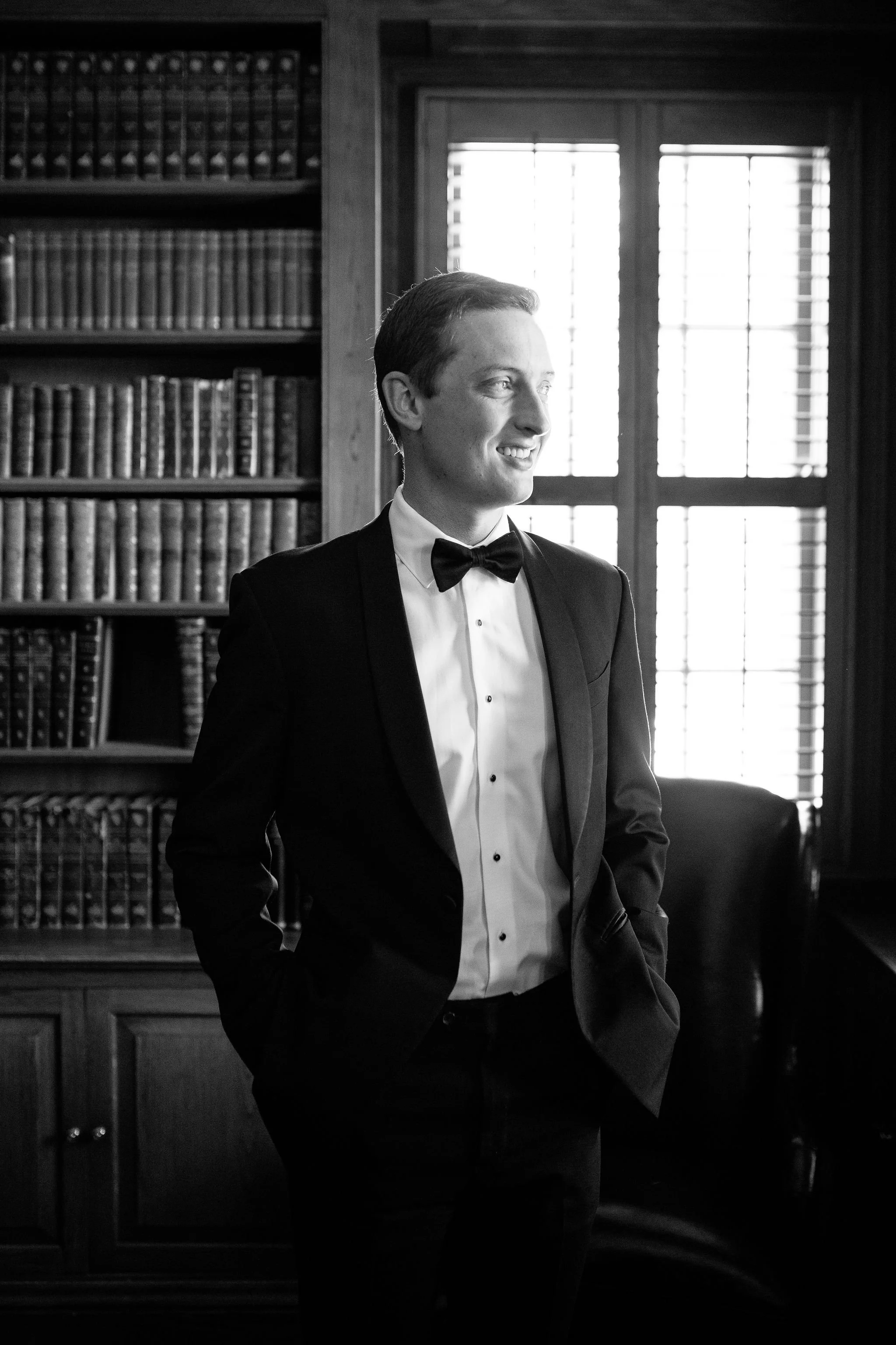 groom portrait in library