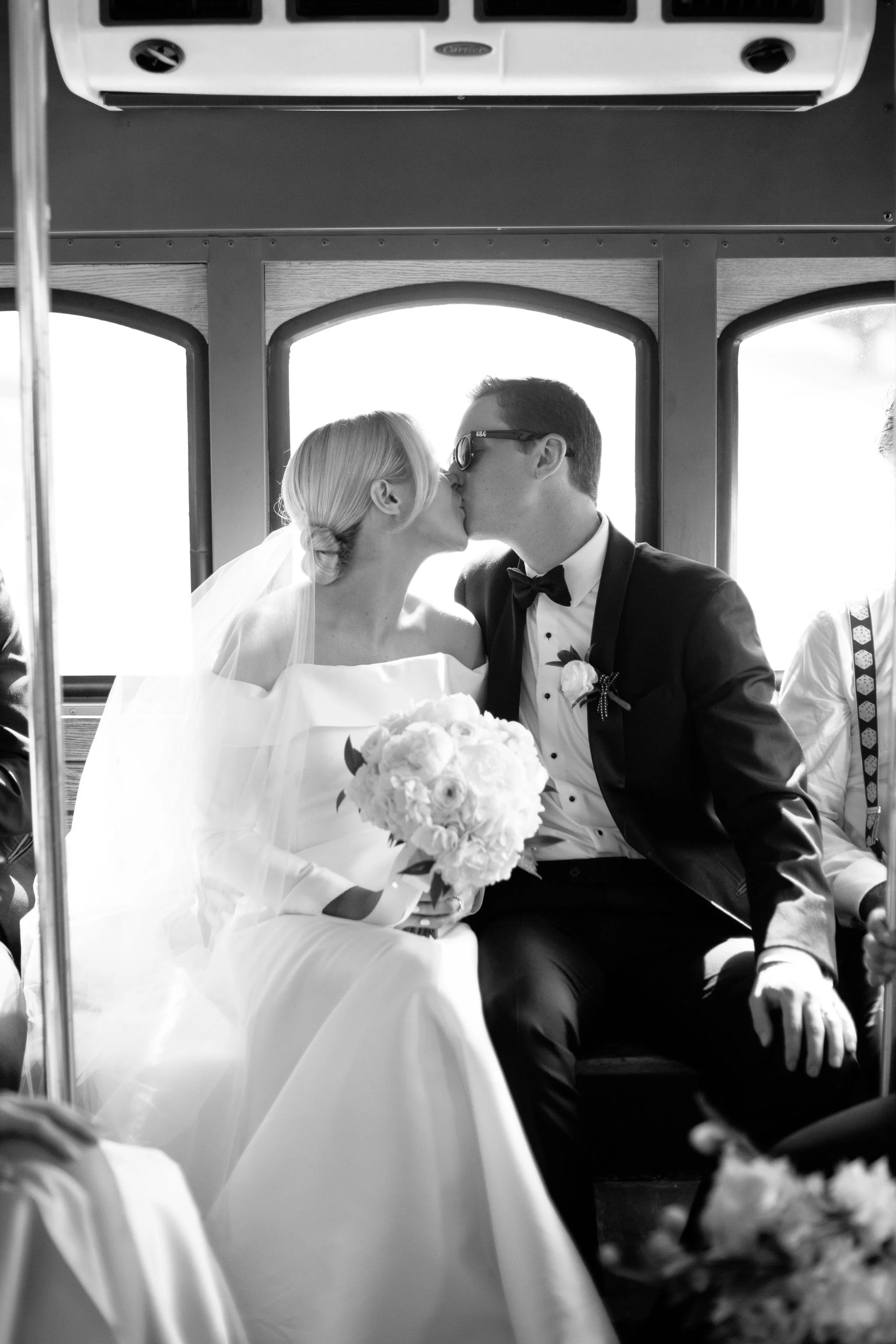 candid bride and groom portrait on trolley