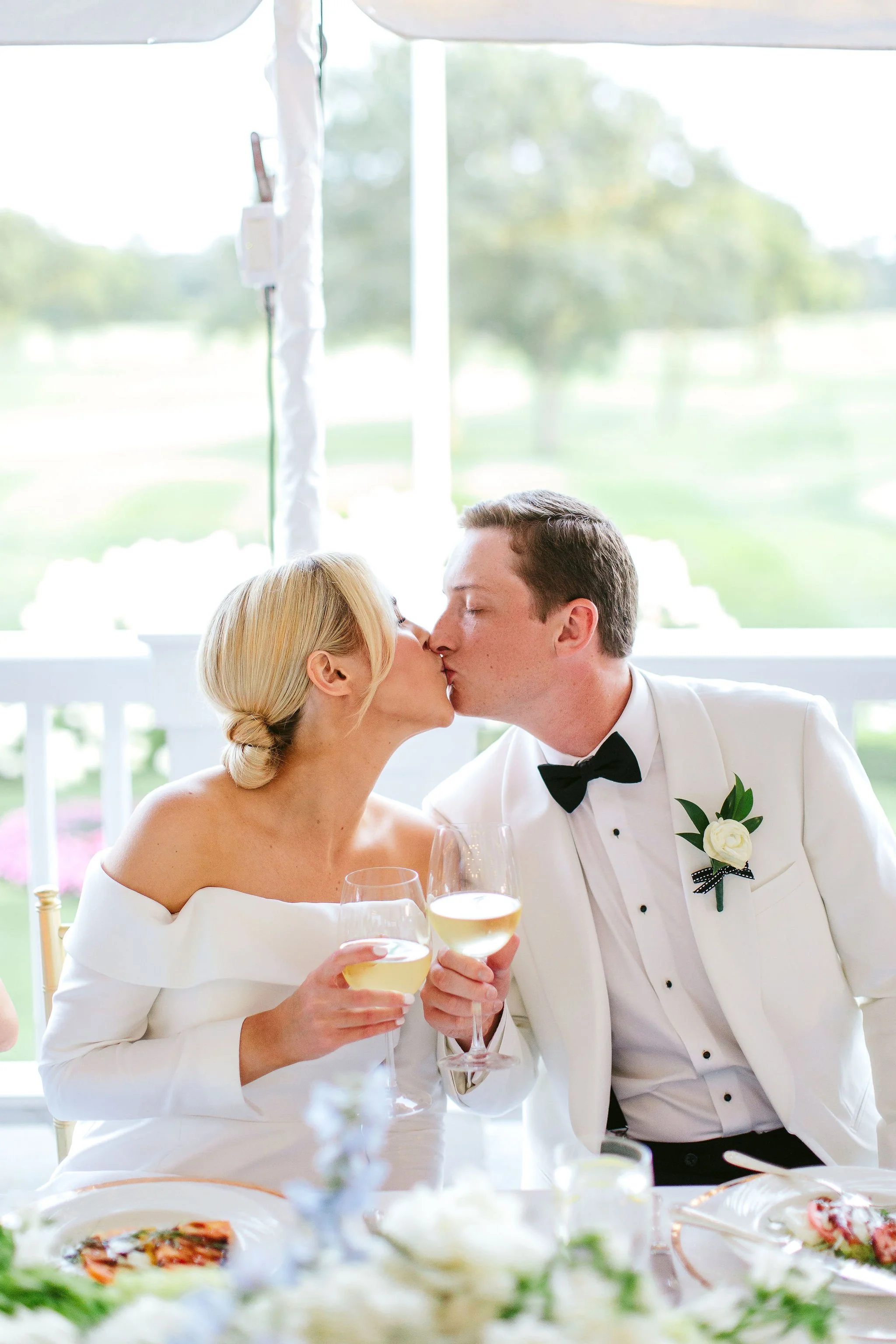 bride and groom kissing at westmoreland country club reception