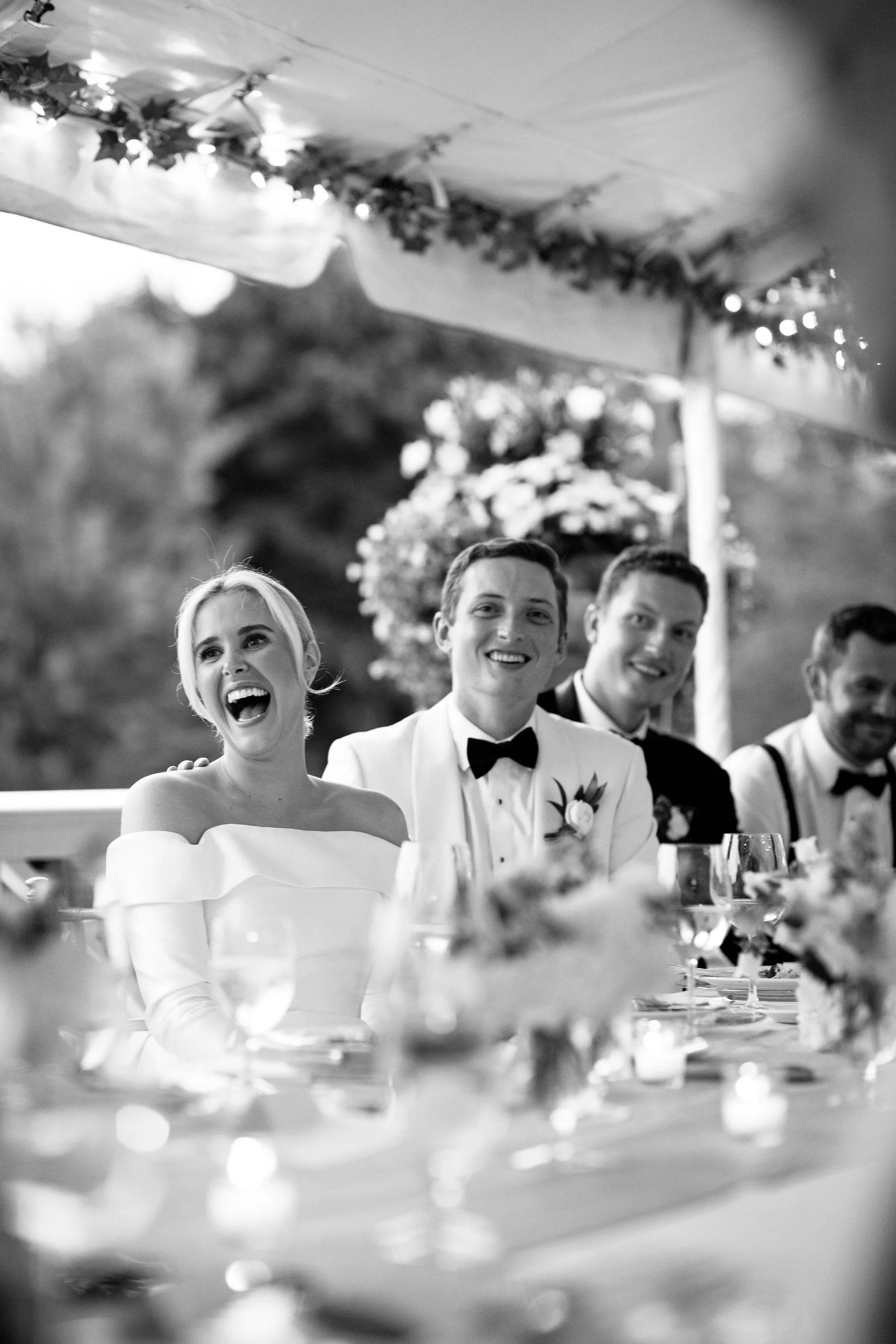 bride laughing at speeches at chicago wedding