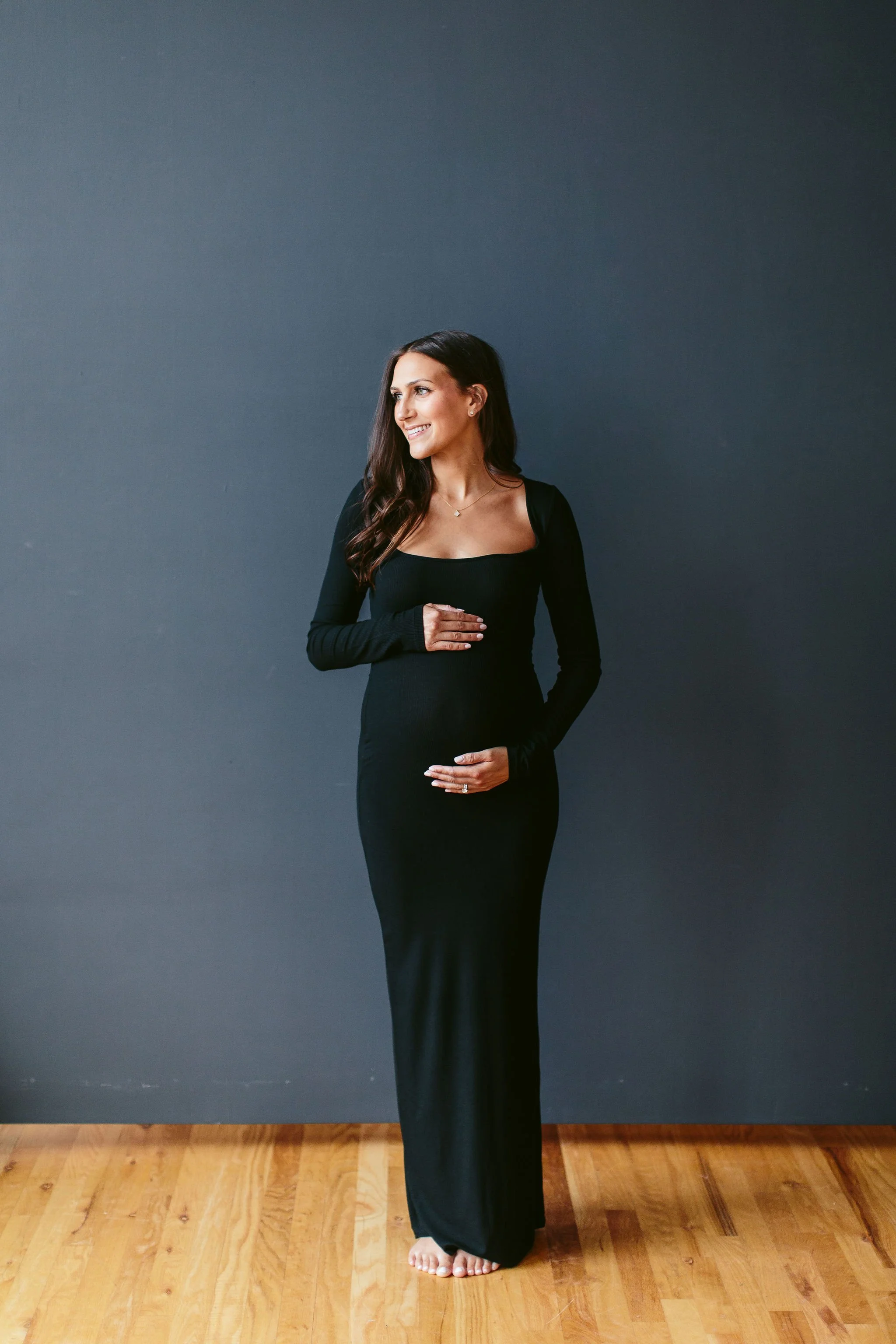 Maternity photos with a backdrop