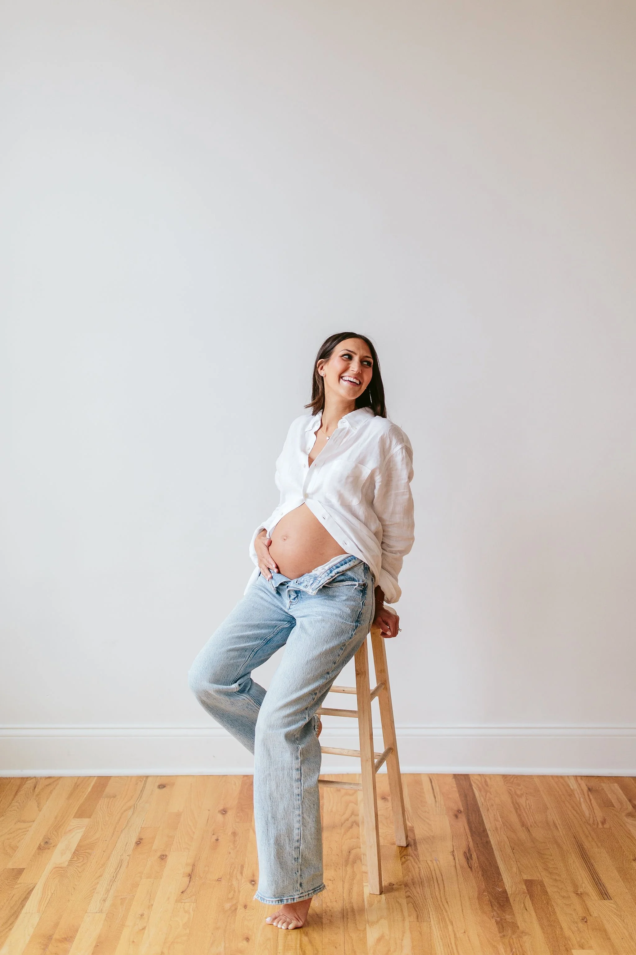 Jeans and white button down for maternity photos