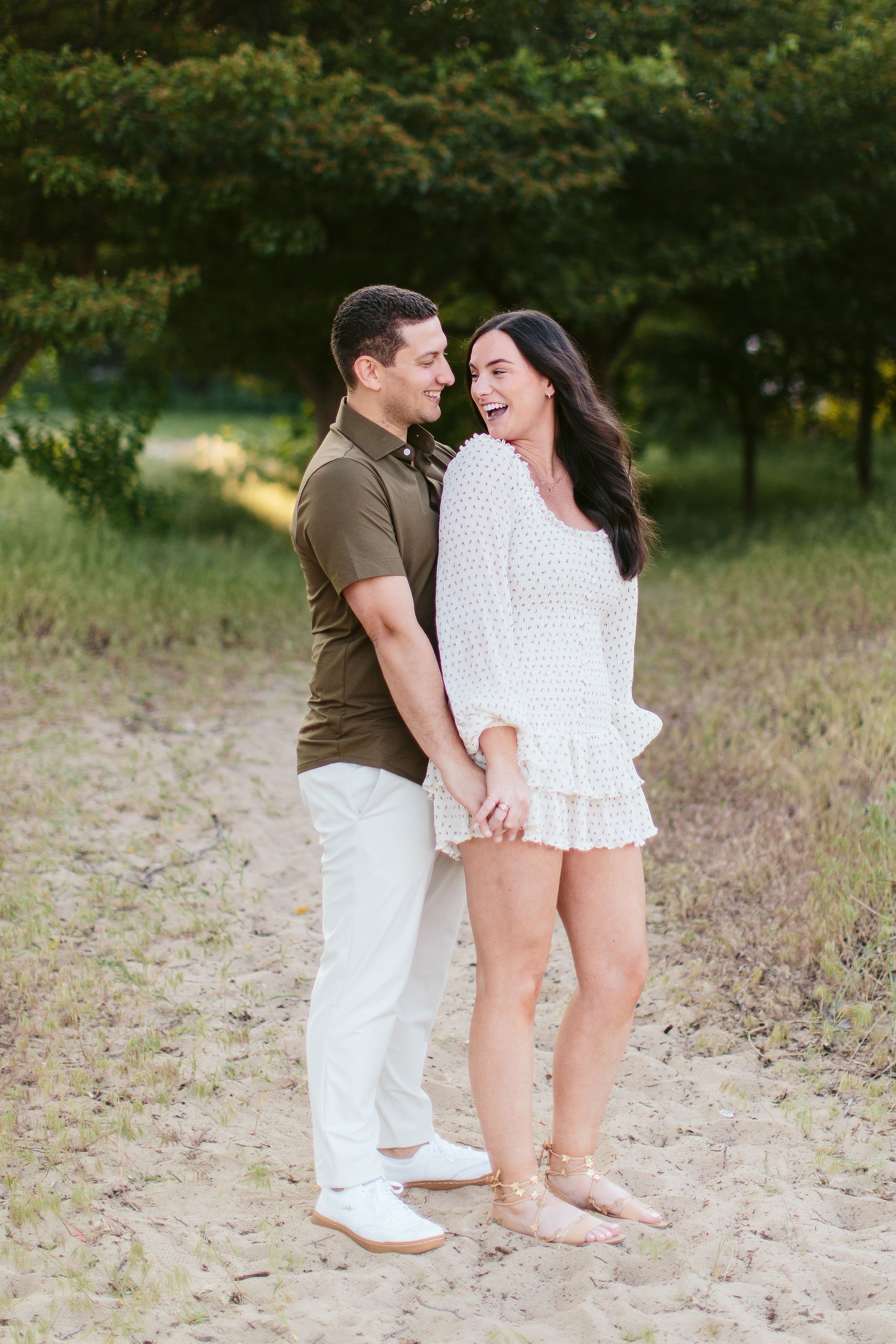 Couple looking at each other on sandy path