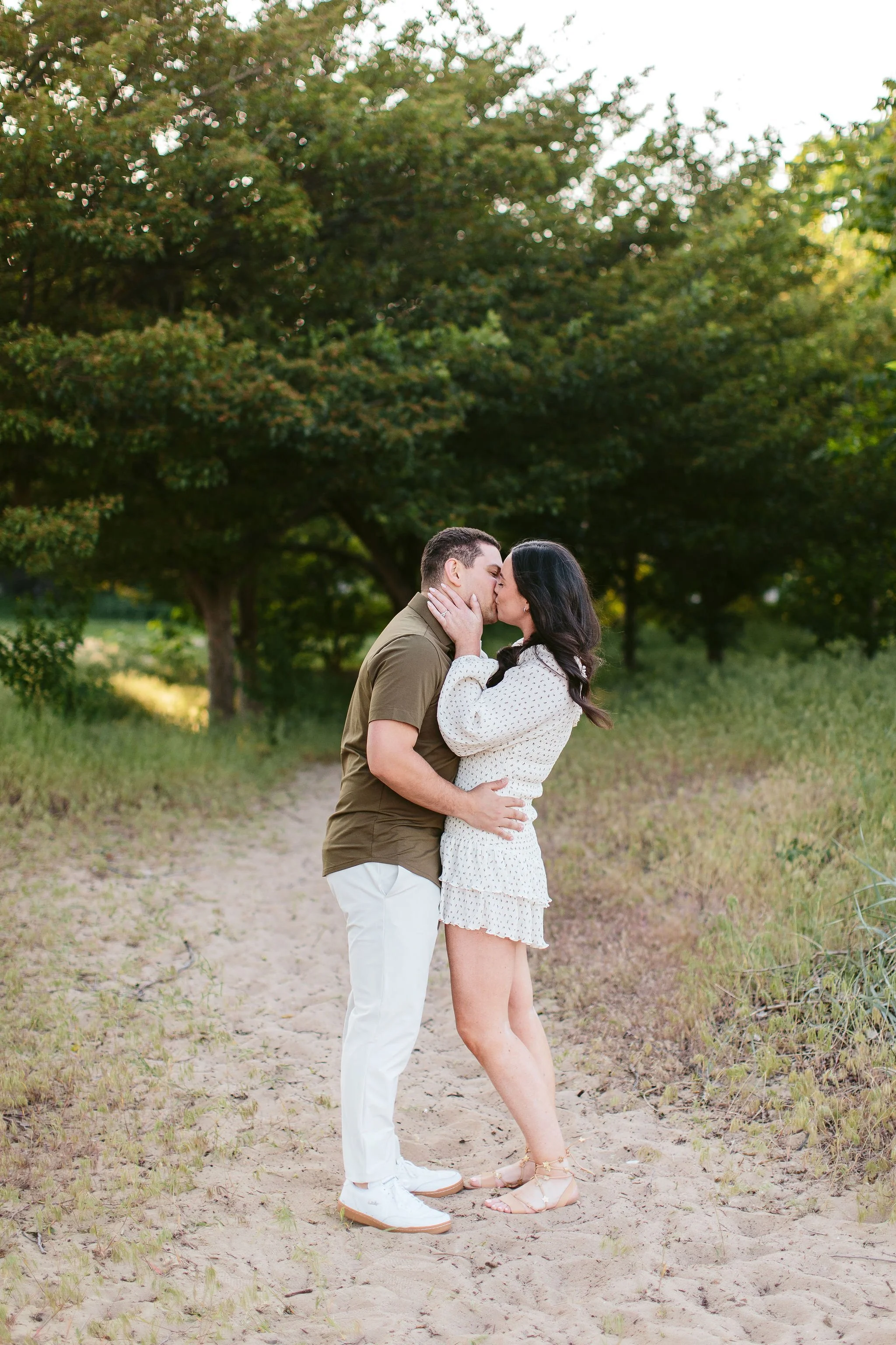 Couple kissing on beach path