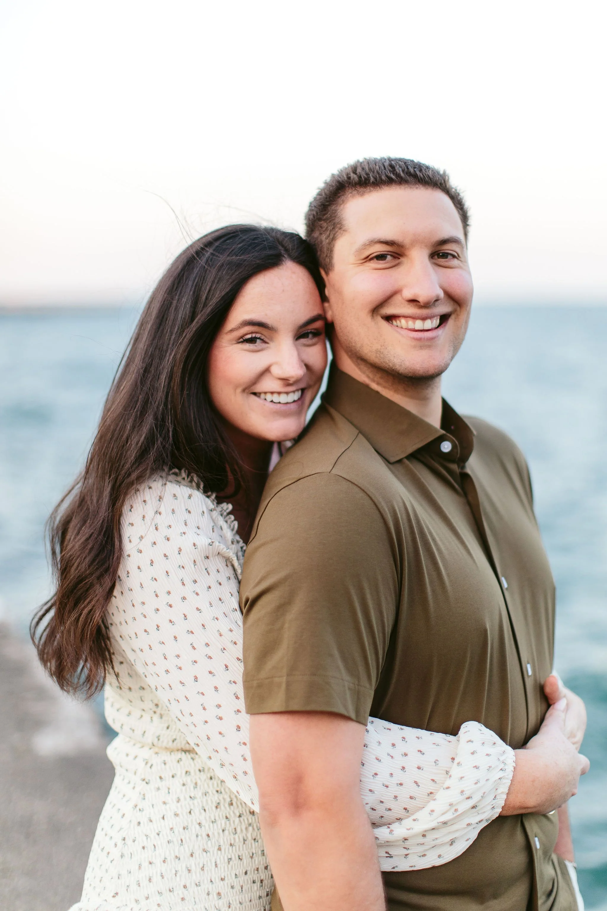 Young couple posing for engagement photos ini Chicago