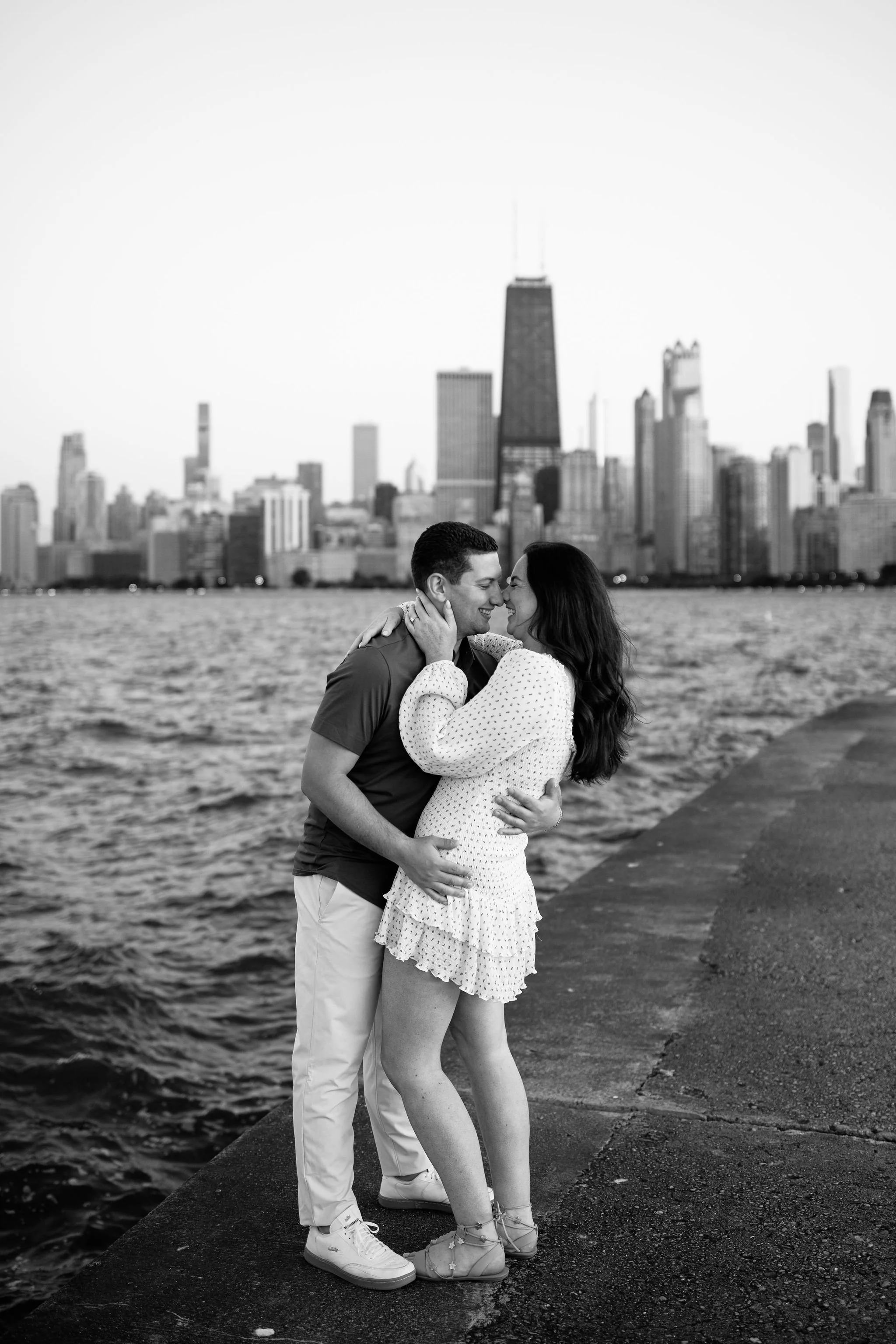Classic black and white engagement photo with Chicago skyline