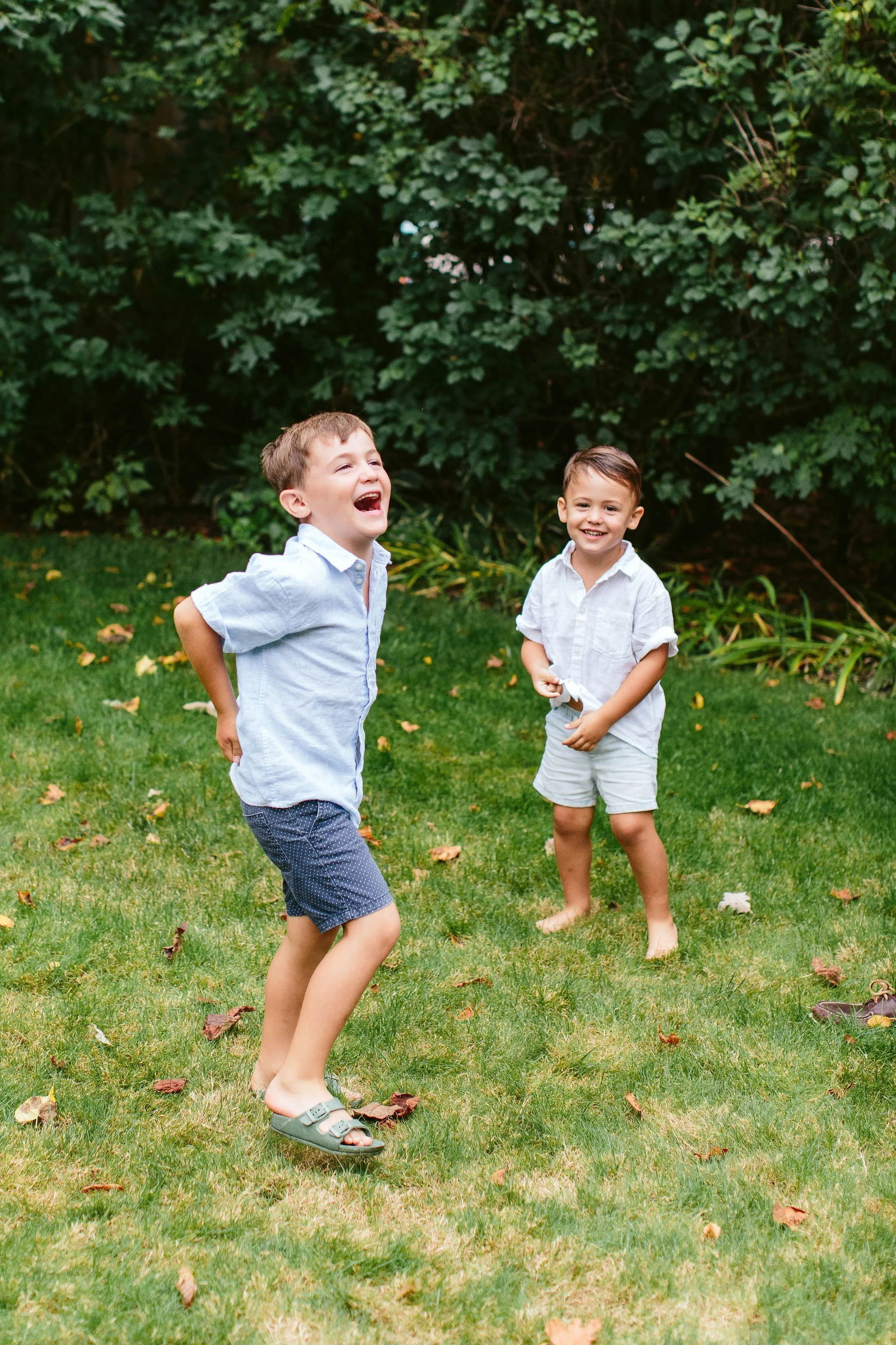two young boys laughing during family session