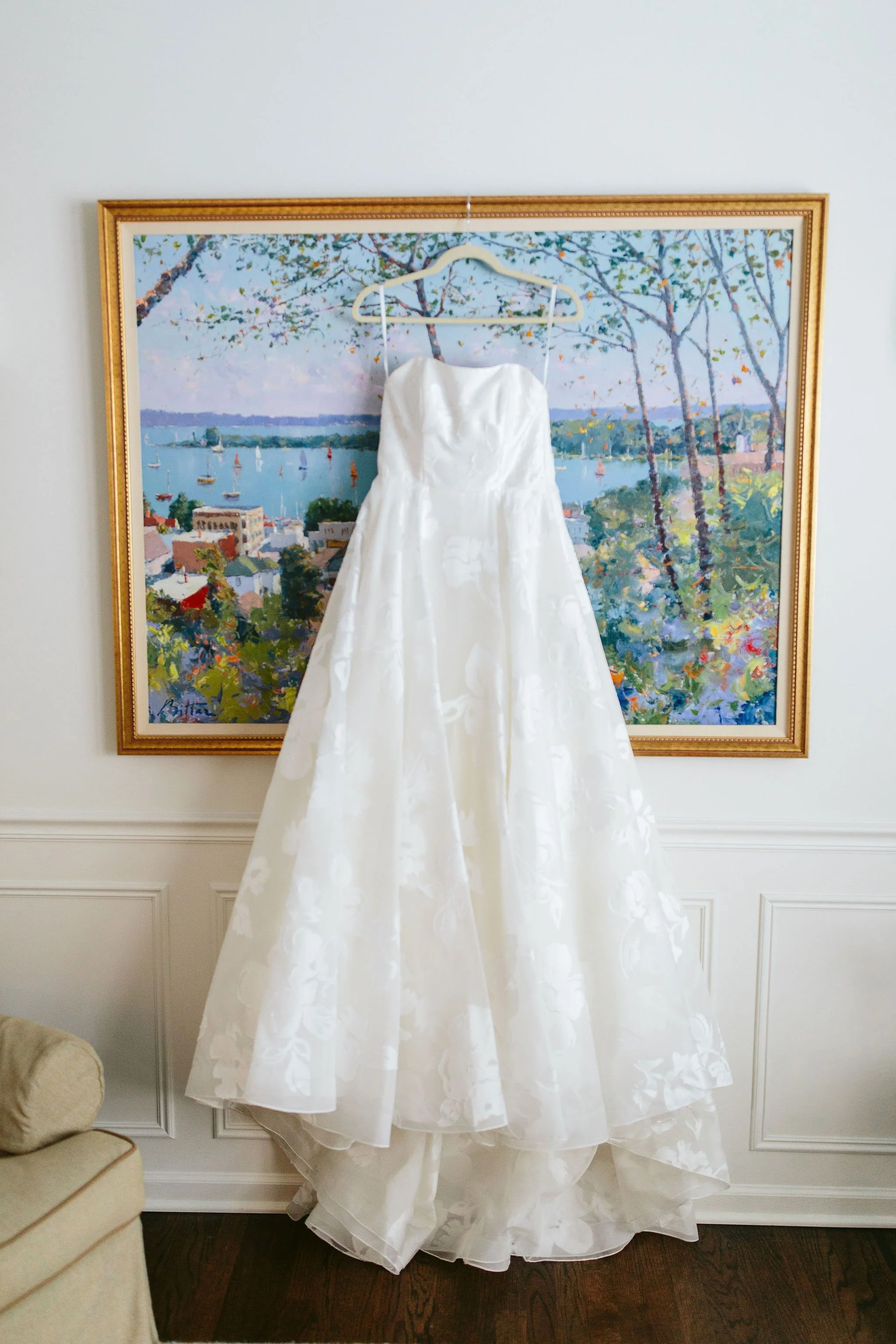 Chicago bride's dress hanging on artwork