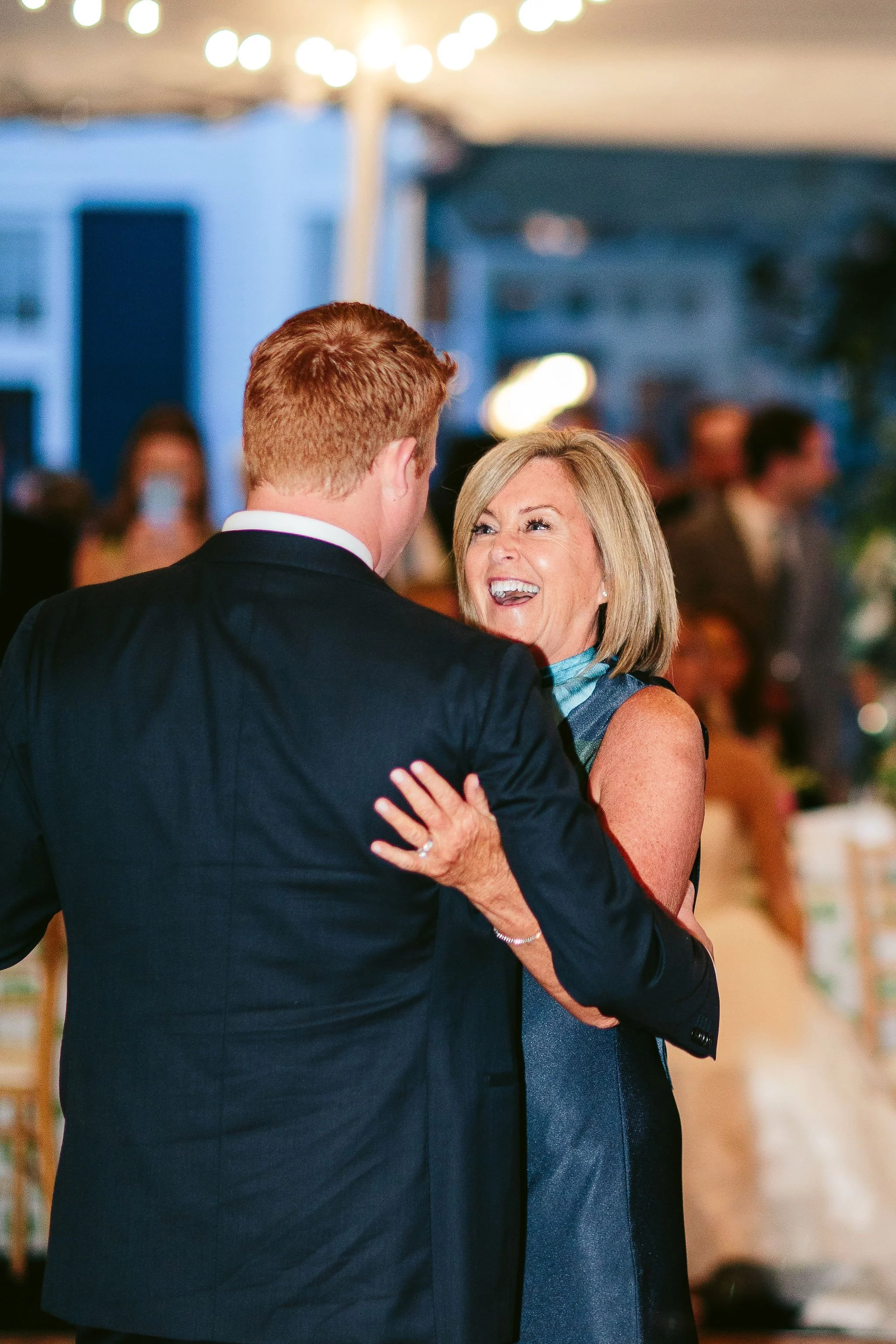 Mother dancing with her son at Lake Bluff wedding